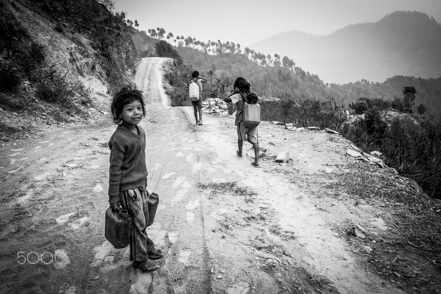 Panasonic Lumix DMC-GX1 + Panasonic Lumix G 14mm F2.5 ASPH sample photo. Fetching water photography