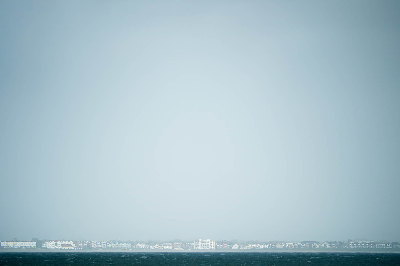 Panasonic Lumix G Vario 45-200mm F4-5.6 OIS sample photo. Coastal buildings photography