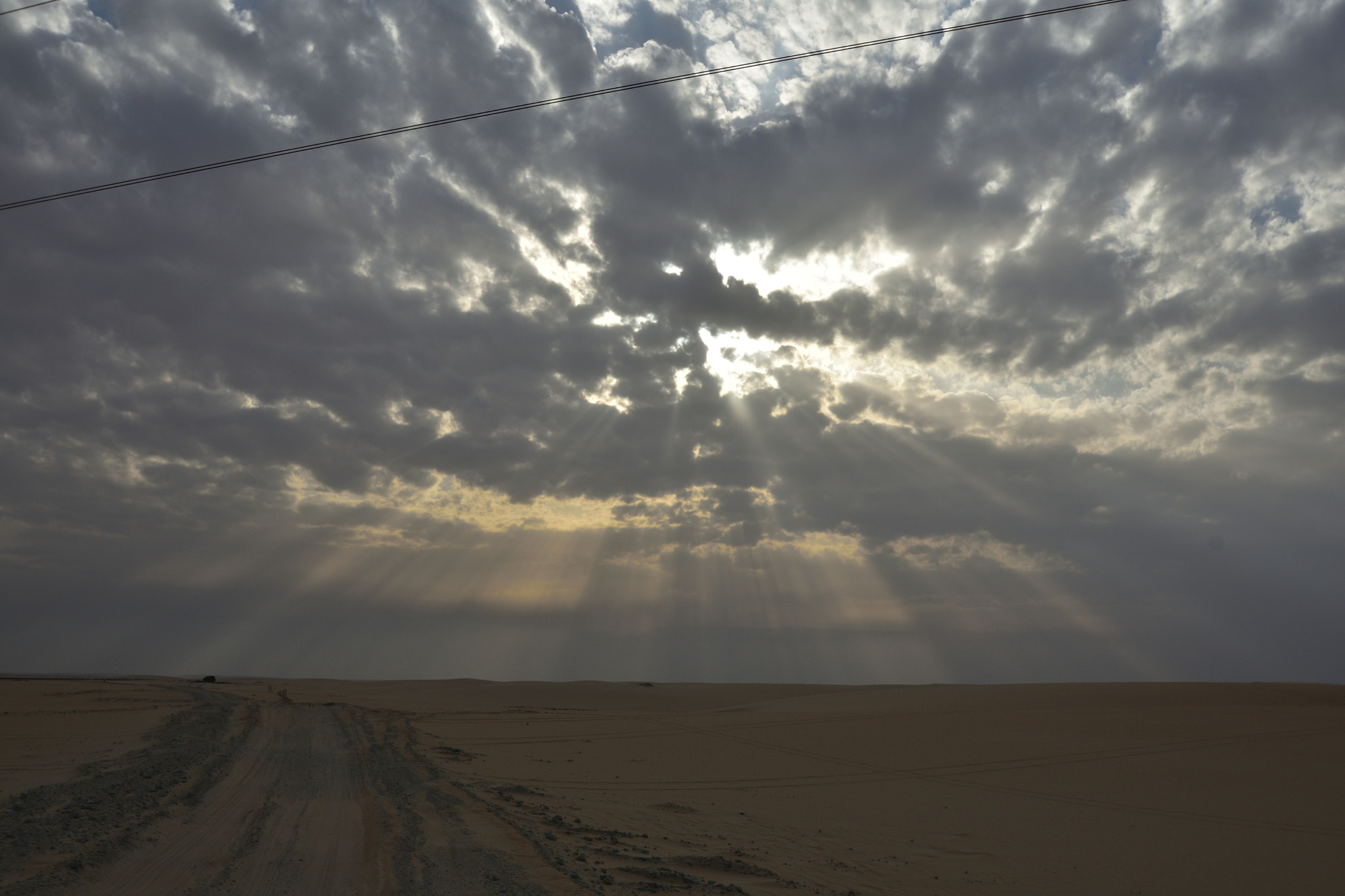 Nikon D3400 sample photo. Clouds and sand photography