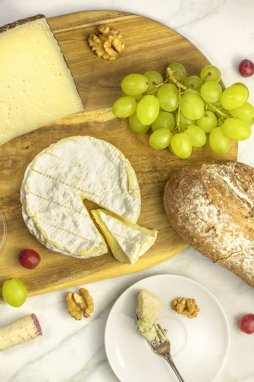 Canon EOS 5DS R sample photo. Selection of cheeses wth bread, grapes, and a wine cork photography
