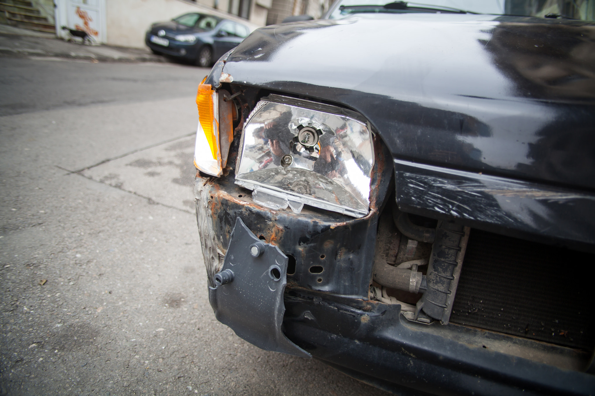 Canon EF 20-35mm f/2.8L sample photo. Crashed car headlight detail photography