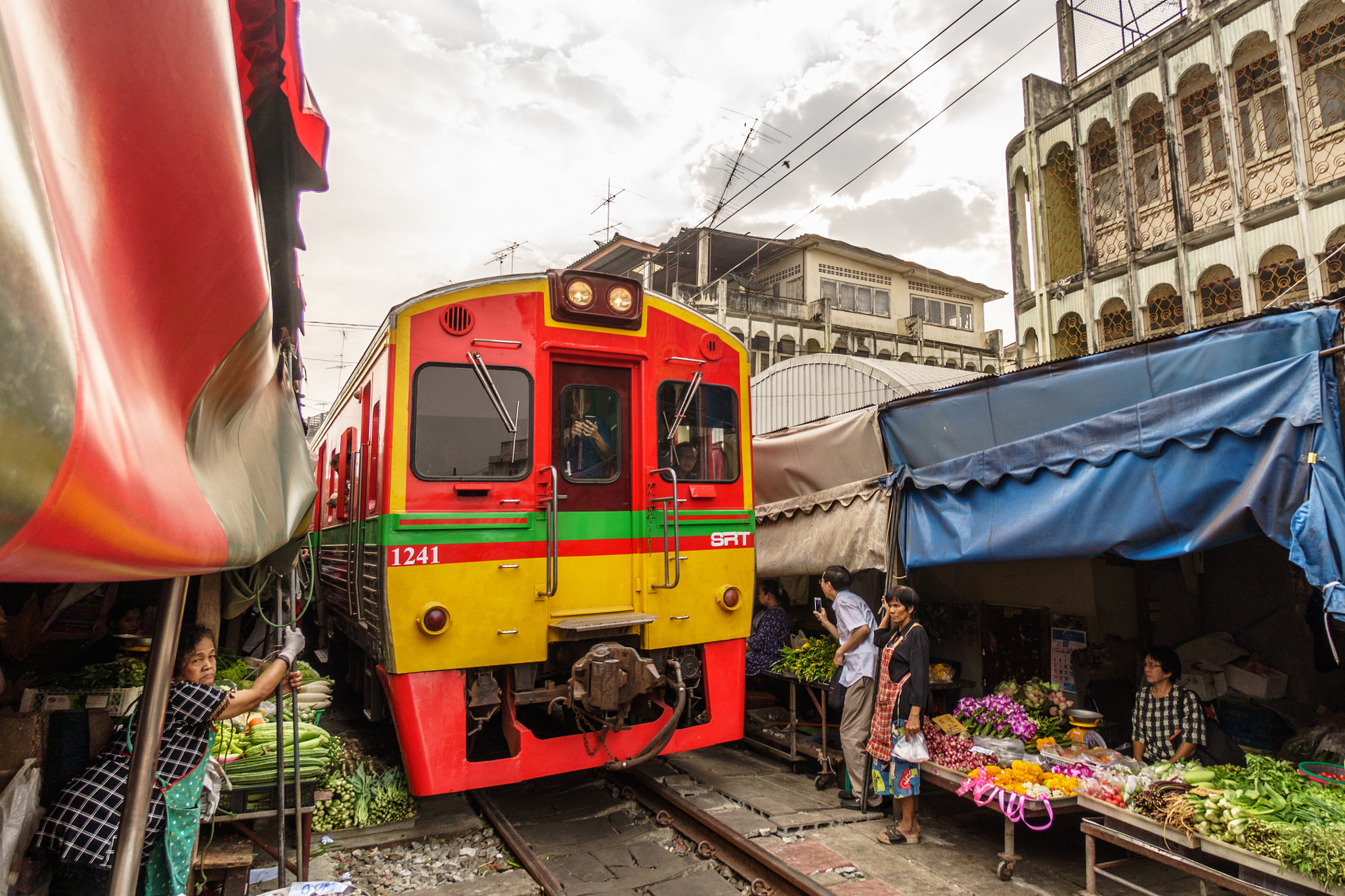 Sony a6500 + Sony E 10-18mm F4 OSS sample photo. Train in market photography