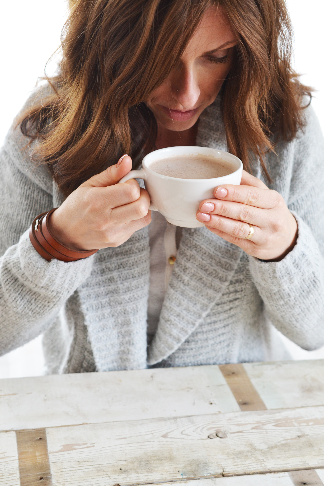 Nikon AF-S DX Micro Nikkor 40mm F2.8 sample photo. Woman wearing sweater drinking from mug photography