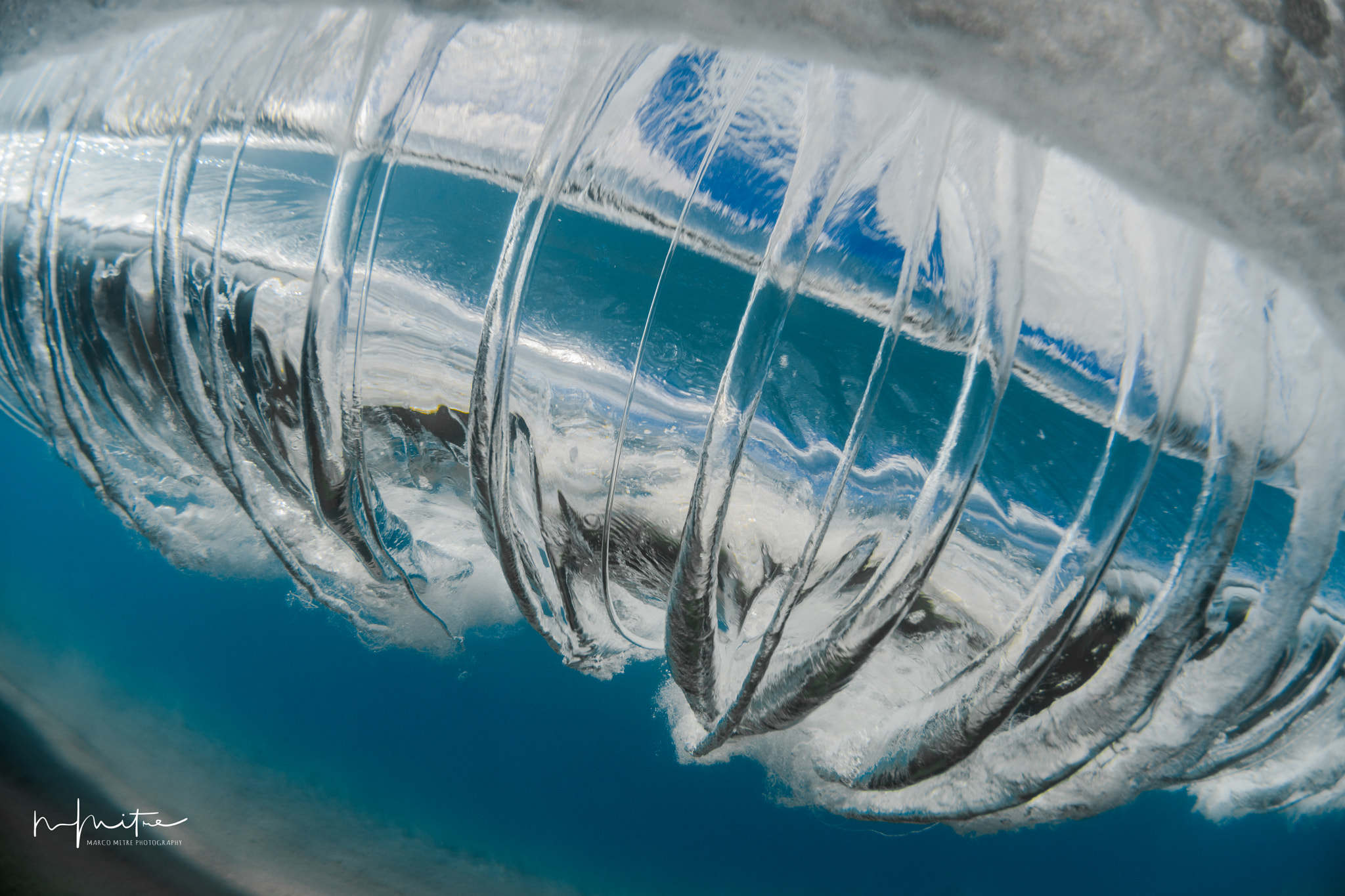 Nikon AF DX Fisheye-Nikkor 10.5mm F2.8G ED sample photo. Some underwater photography vortexes created by the rolling waves photography