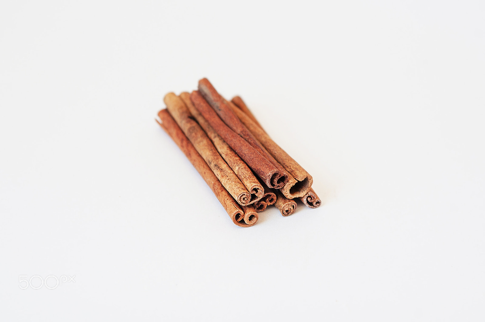 Nikon D700 + Sigma 24-70mm F2.8 EX DG Macro sample photo. Cinnamon sticks over a white background photography