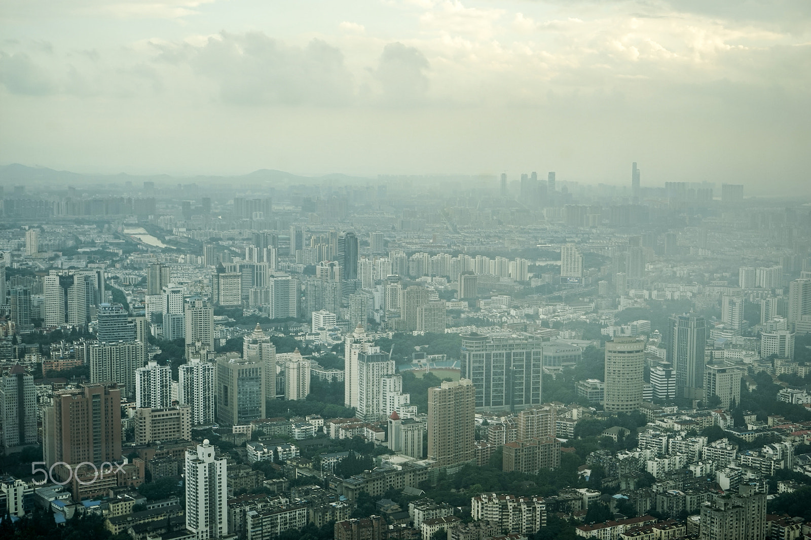 Sony a7 + Sony Vario Tessar T* FE 24-70mm F4 ZA OSS sample photo. Misty & cloudy city photography