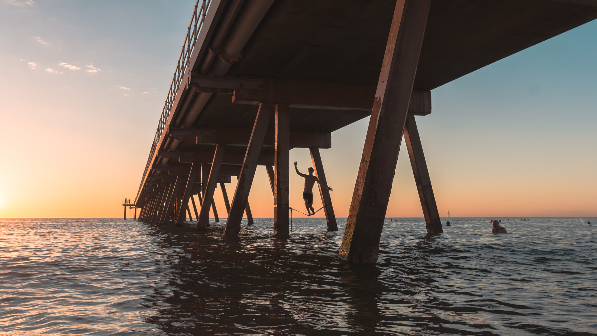 Sony Alpha NEX-5N sample photo. Tight roping at glenelg beach photography