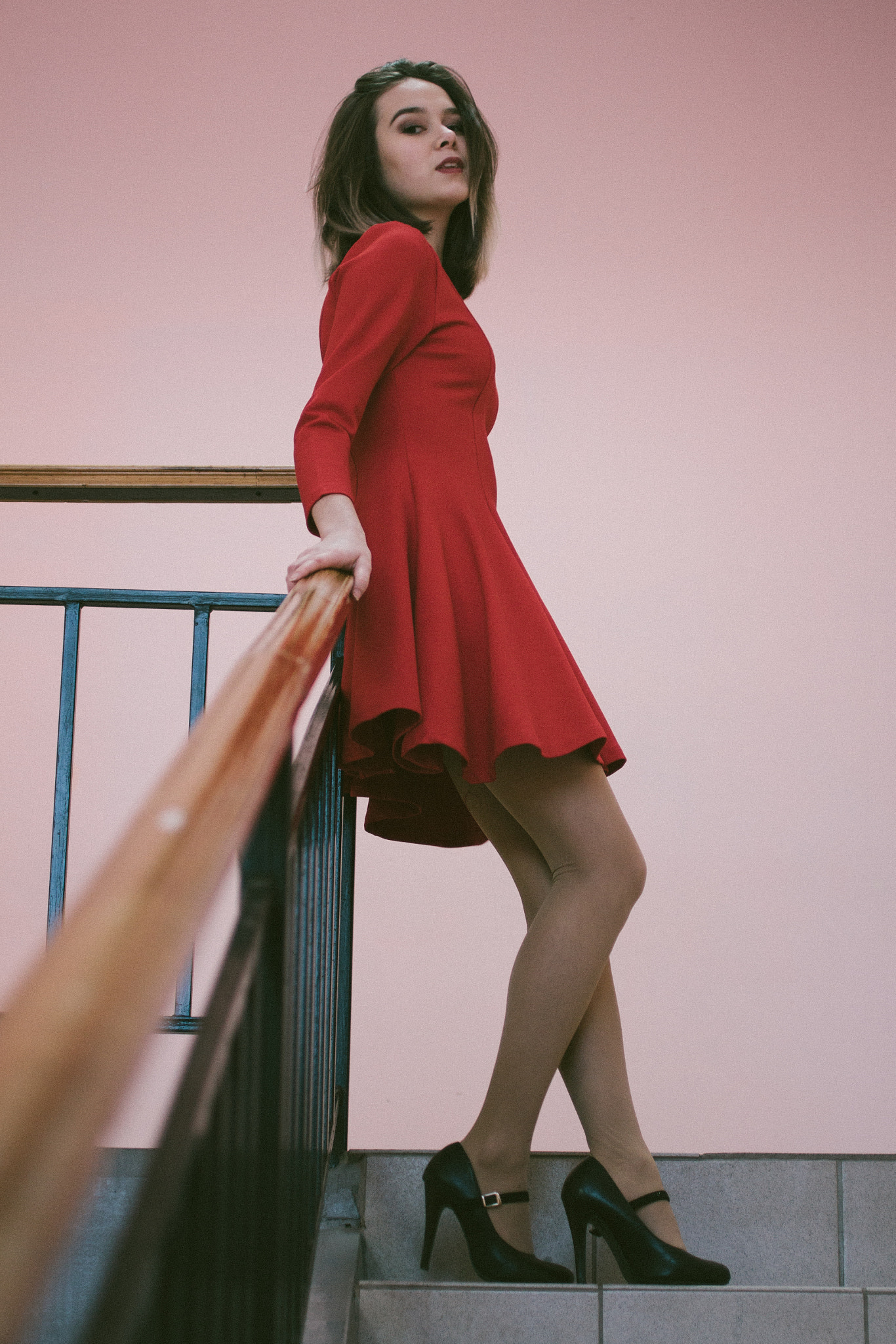 Canon EF 50mm F2.5 Macro sample photo. Young girl in a red dress next to the stairs. photography