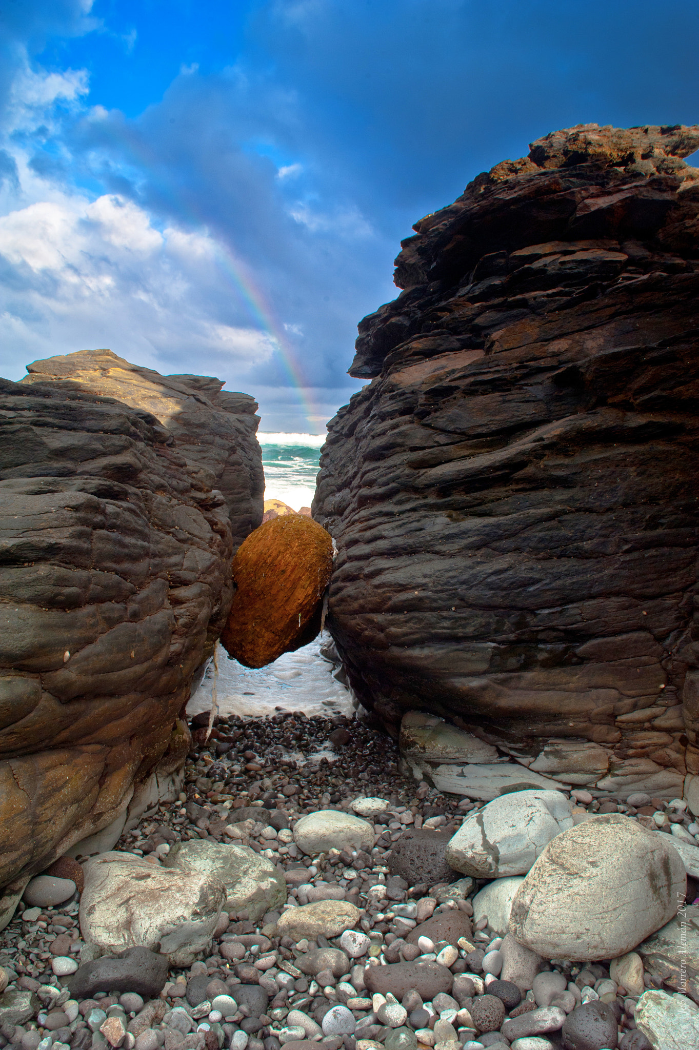 Nikon D700 + Sigma 24-70mm F2.8 EX DG Macro sample photo. Rainbow over orange stone photography