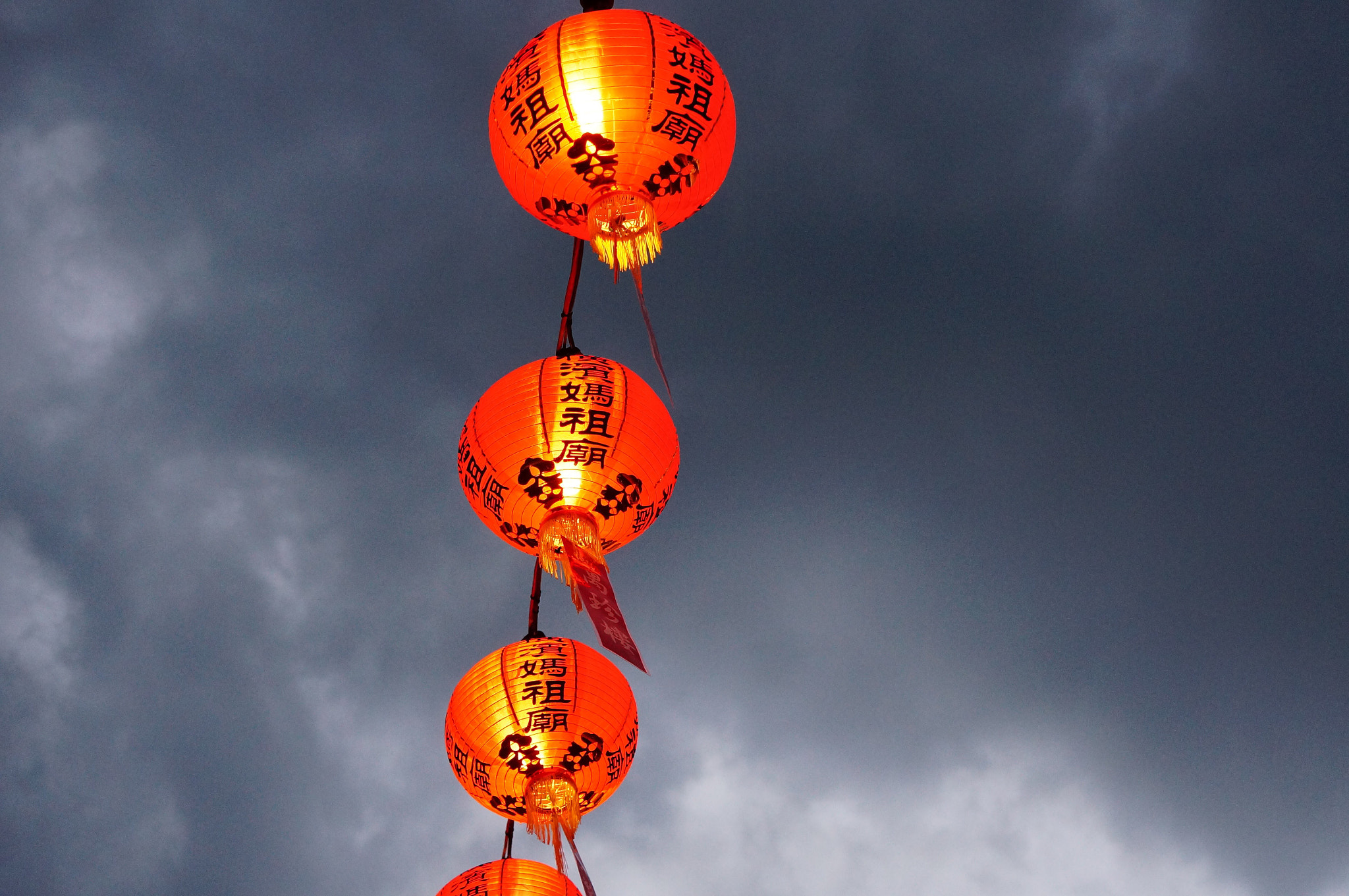 Sony Alpha NEX-5T sample photo. Dark clouds, bright lights photography