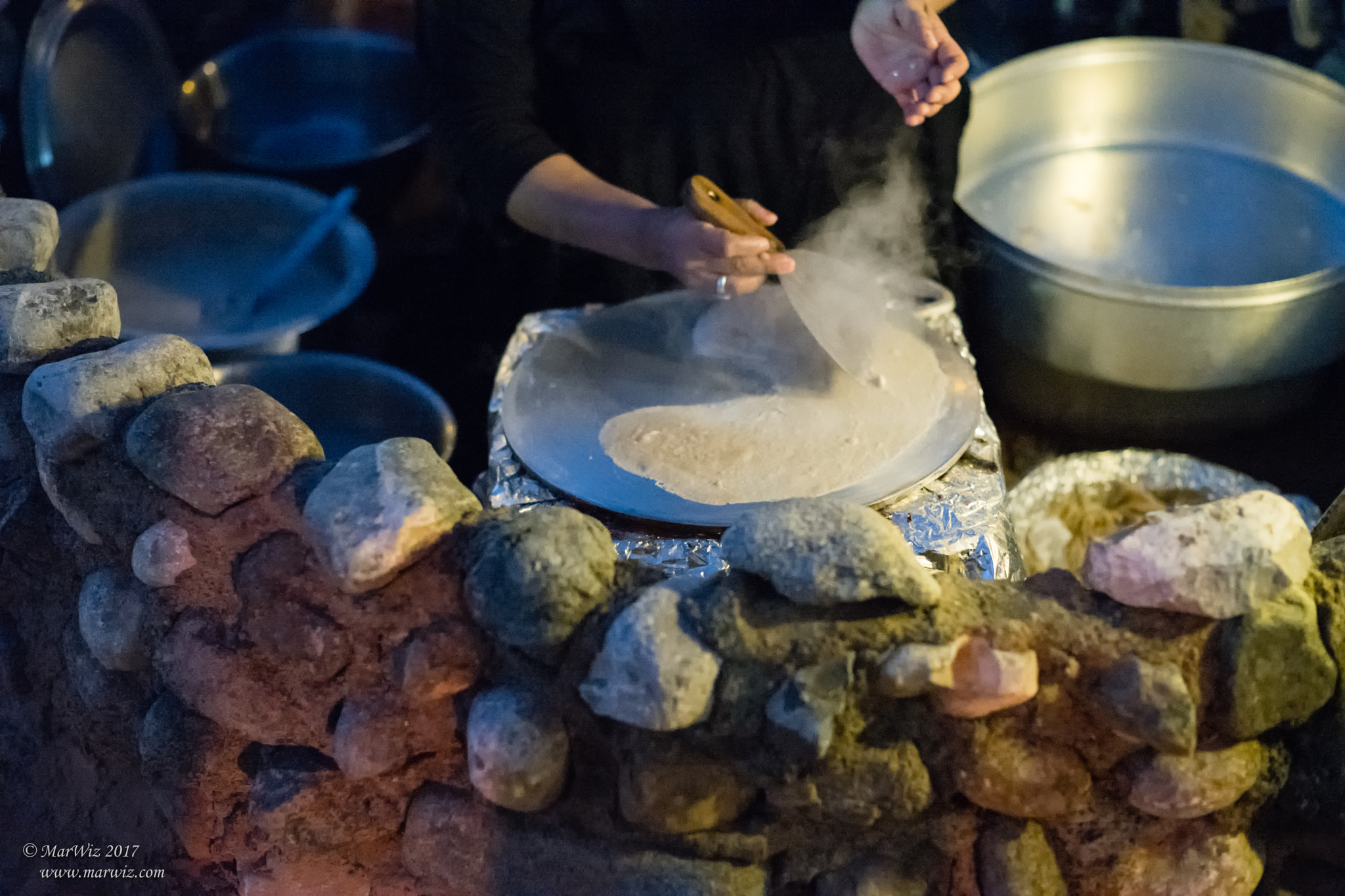 Summilux-M 1:1.4/75 sample photo. Making bread bedouin camp photography