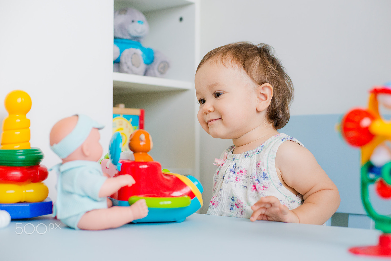 Nikon D800 + Nikon AF Nikkor 50mm F1.4D sample photo. Baby girl playing with educational toy in nursery photography