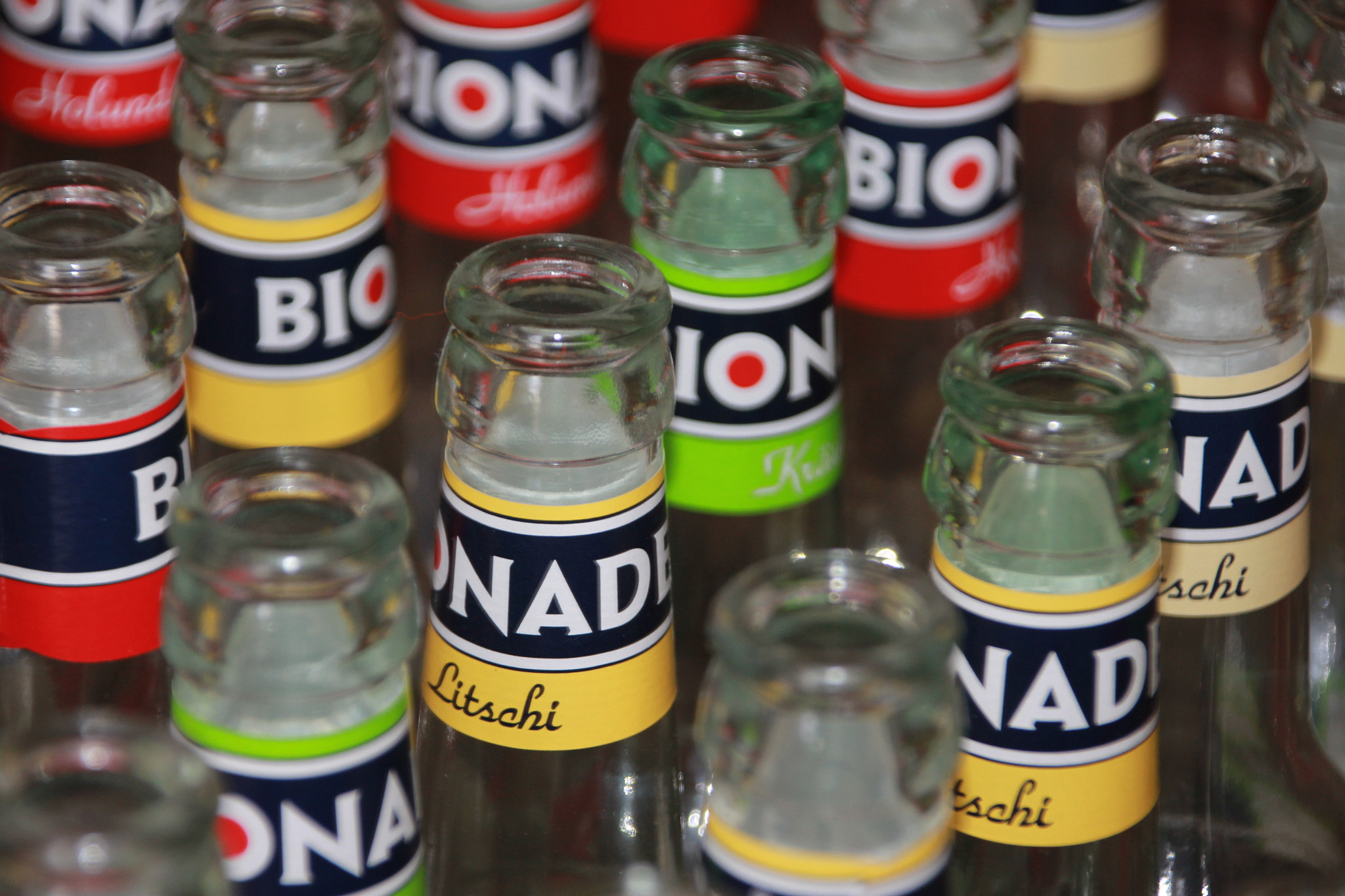 Canon EOS 60D + Canon TS-E 90mm F2.8 Tilt-Shift sample photo. Some dead bionade bottles photography