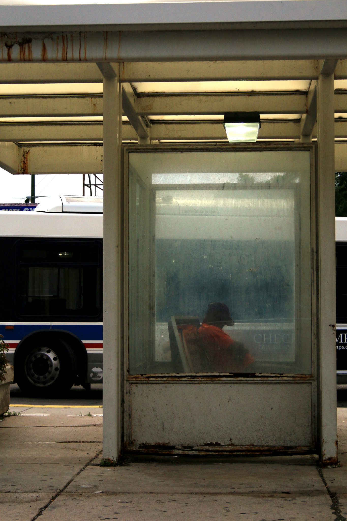 Canon EF-S 18-55mm F3.5-5.6 II sample photo. Bus stop nap photography
