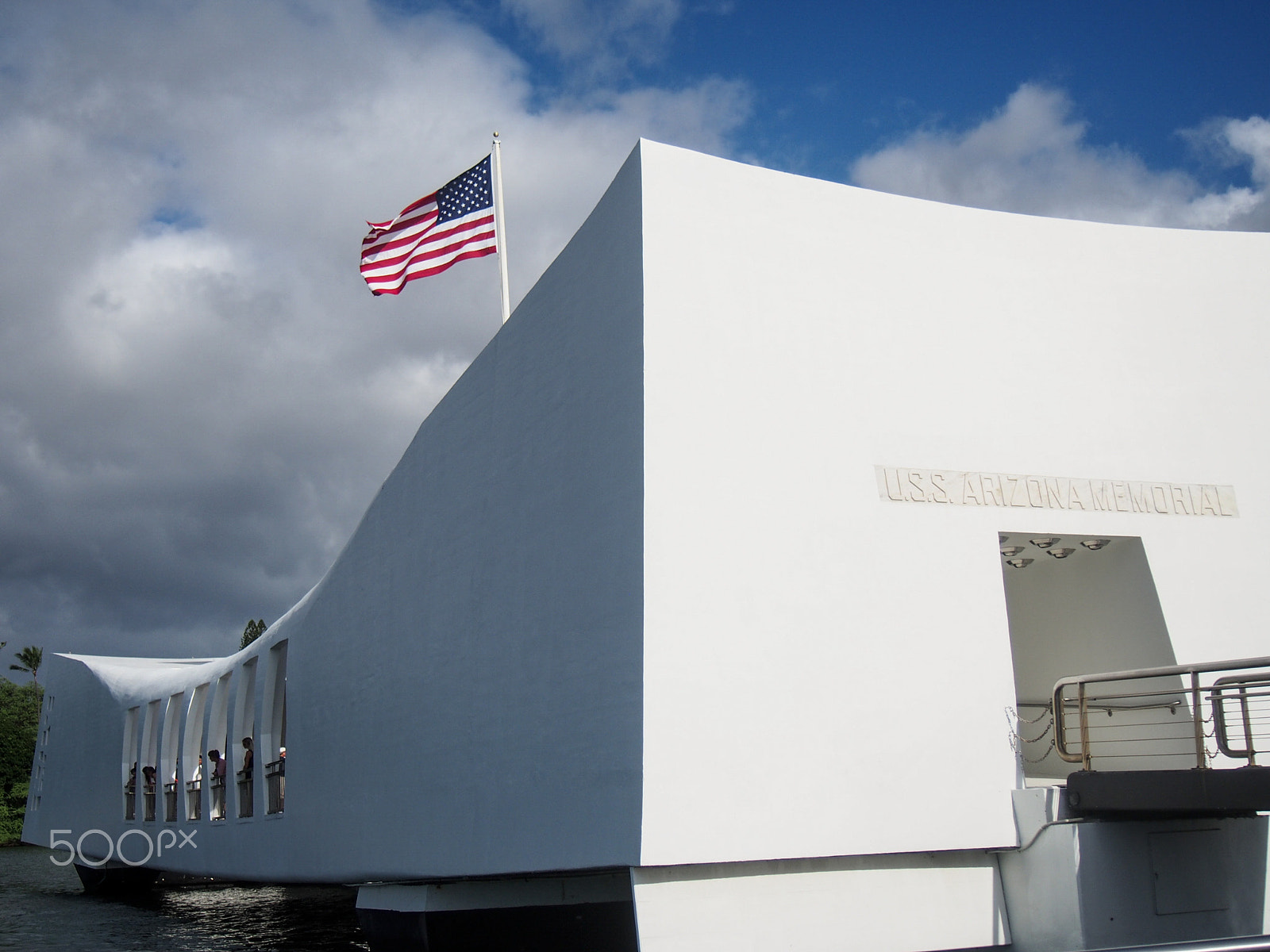 Olympus OM-D E-M5 sample photo. American flag flys over the arizona memorial on oahu hawaii in remembrance of pearl harbor photography