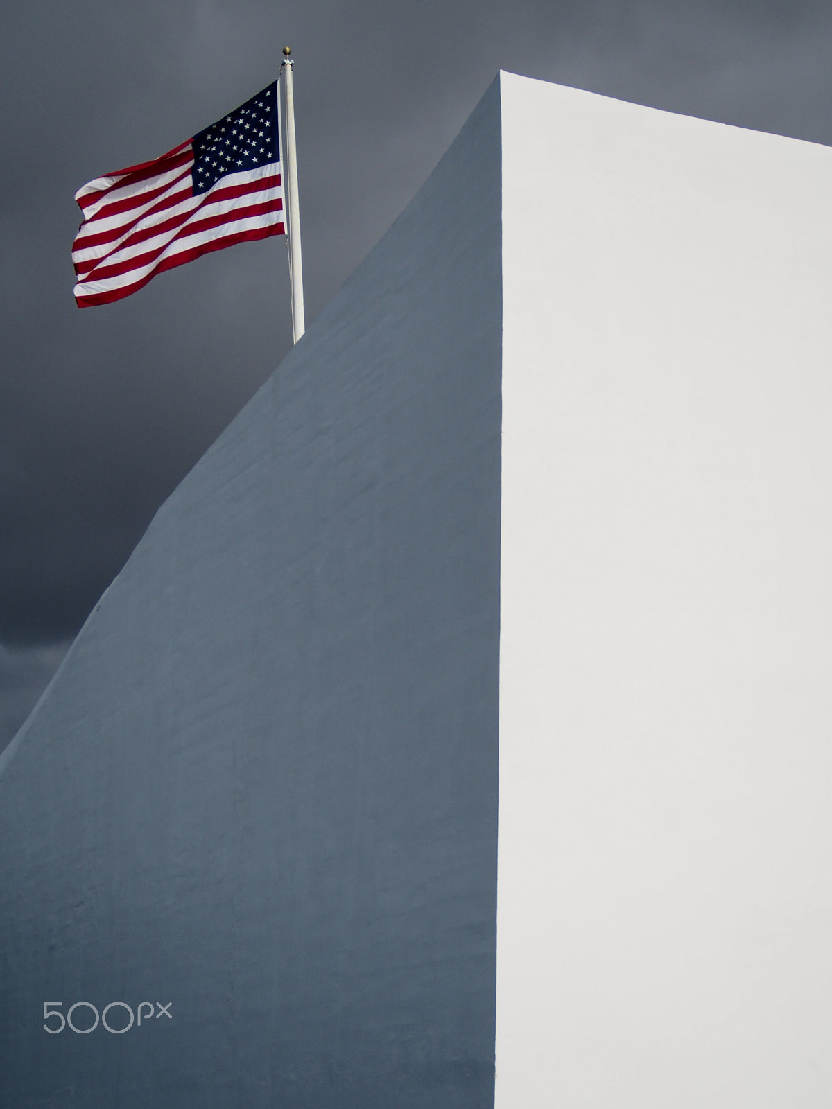 Olympus OM-D E-M5 sample photo. American flag flys over the arizona memorial on oahu hawaii in remembrance of pearl harbor photography