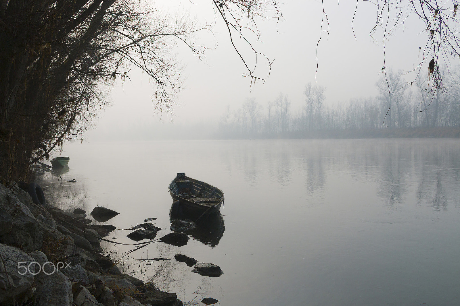 Sigma 18-50mm F2.8-4.5 DC OS HSM sample photo. Abandoned boat in foggy river photography