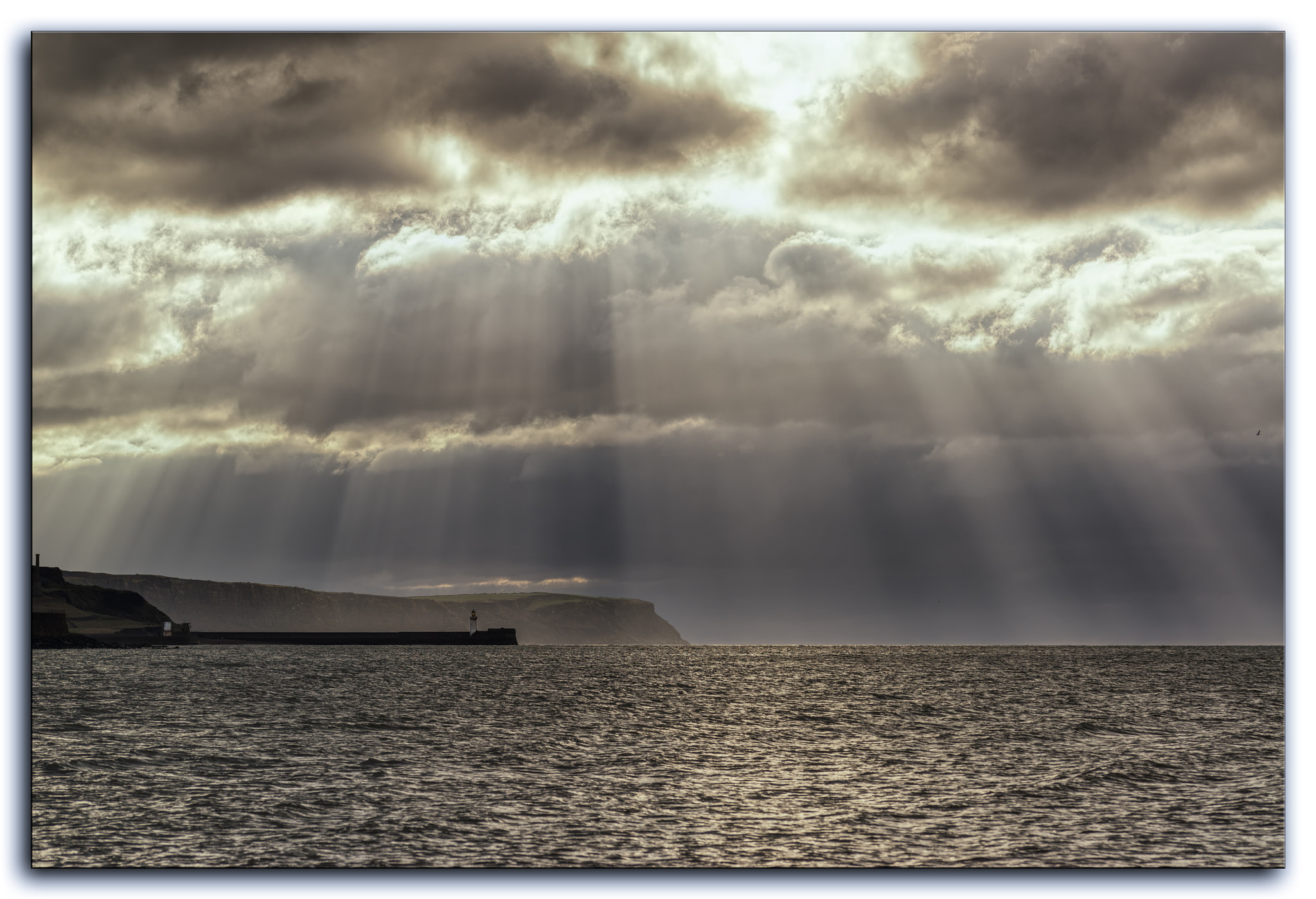 Sigma 105mm F2.8 EX DG OS HSM sample photo. God rays above whitehaven pier, uk. photography