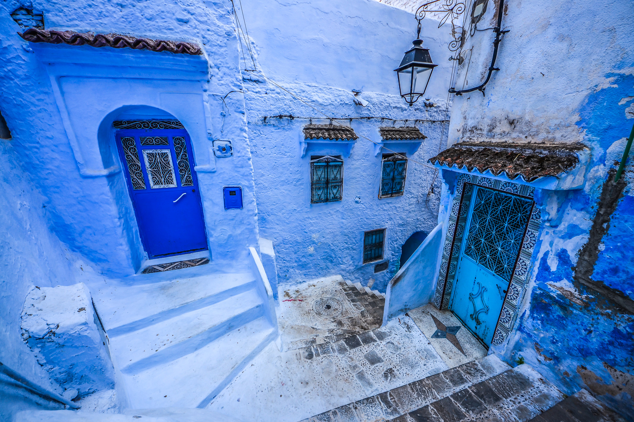 Sigma 8-16mm F4.5-5.6 DC HSM sample photo. Traditional blue door on an old street inside medina of chefchaouen, morocco photography