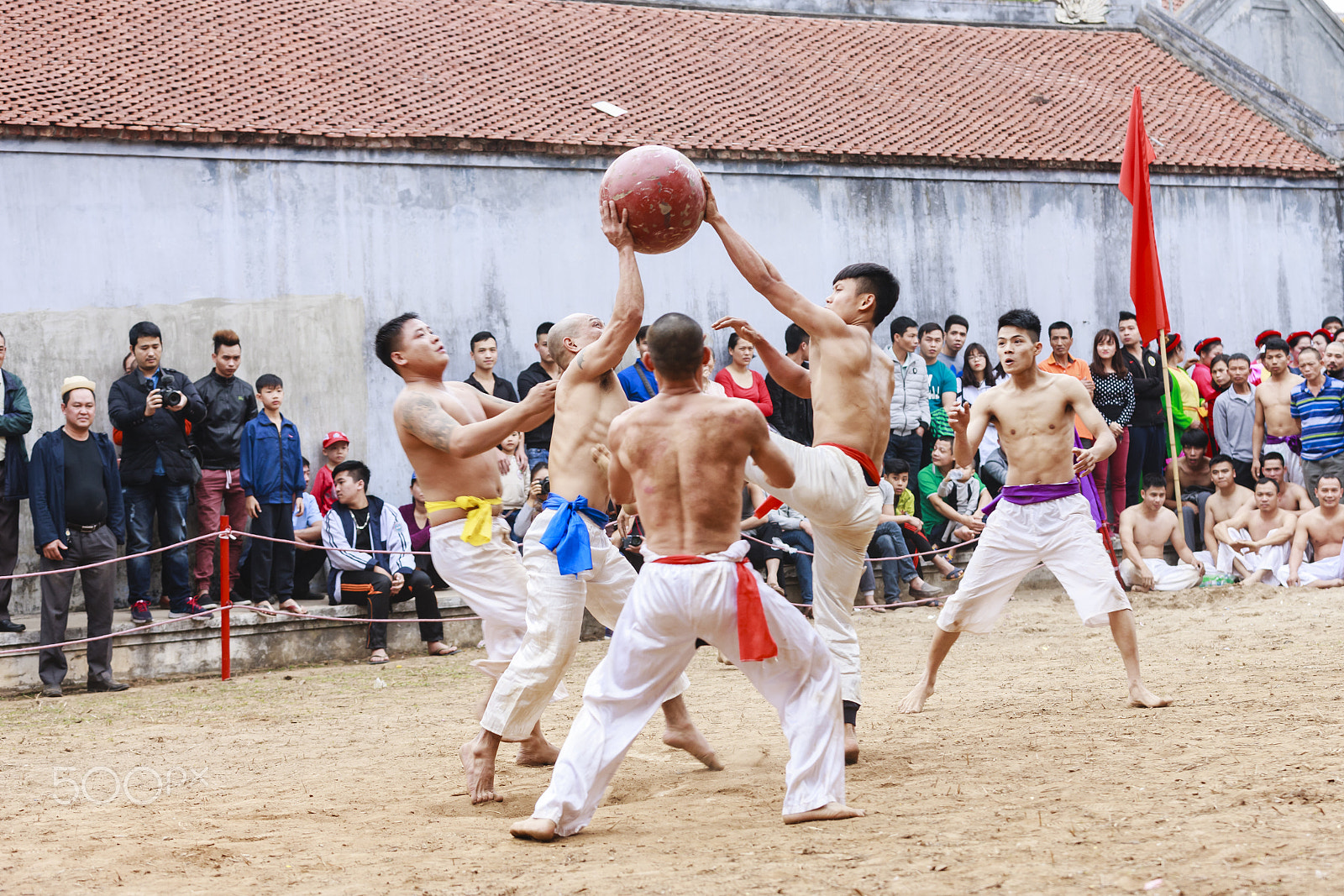 Canon EOS-1Ds Mark III sample photo. Young men play with wood ball photography