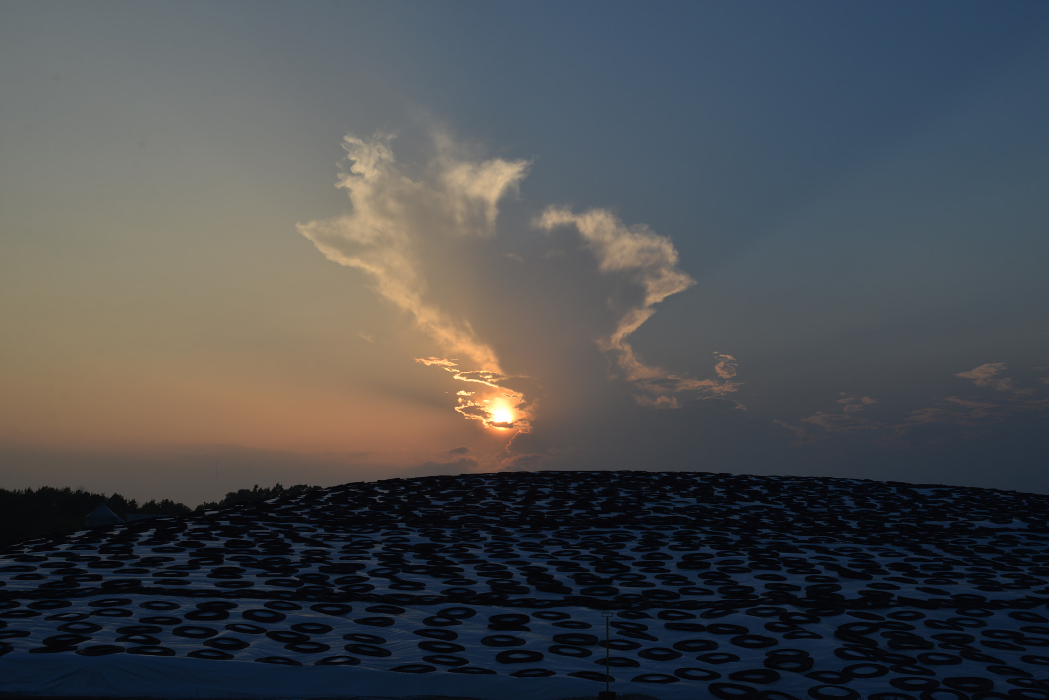 Nikon D600 + Nikon AF Nikkor 50mm F1.8D sample photo. Unedited incoming storm on the horizon at sunset photography