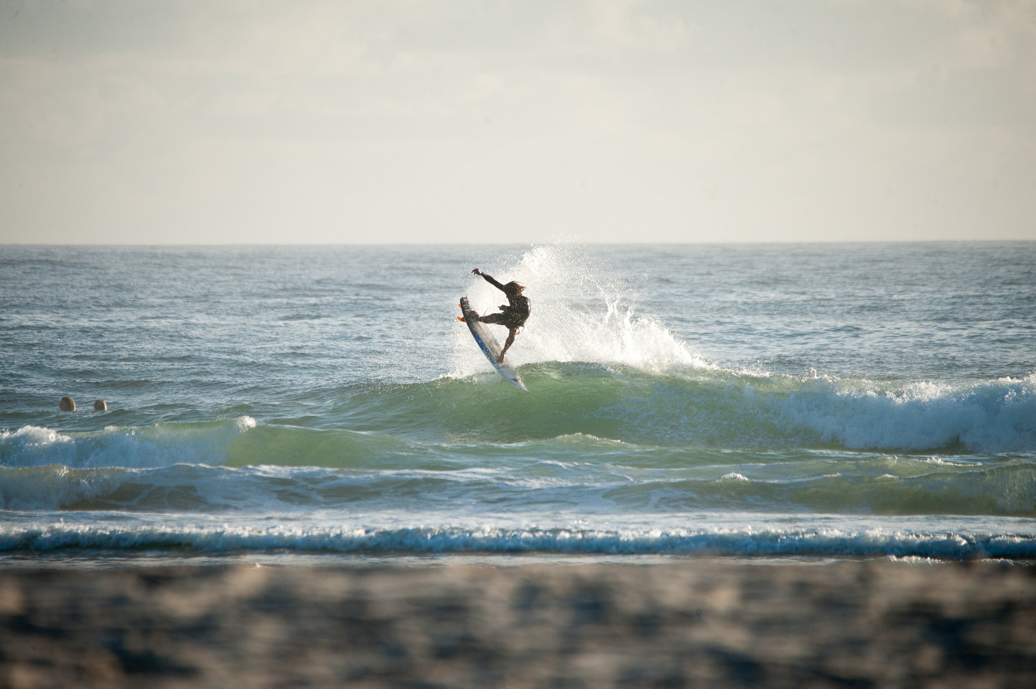 Nikon D3 sample photo. Tail high in a fun morning surf photography
