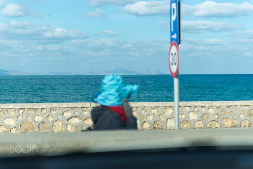 Nikon D610 sample photo. Woman with blue hat blending in. photography