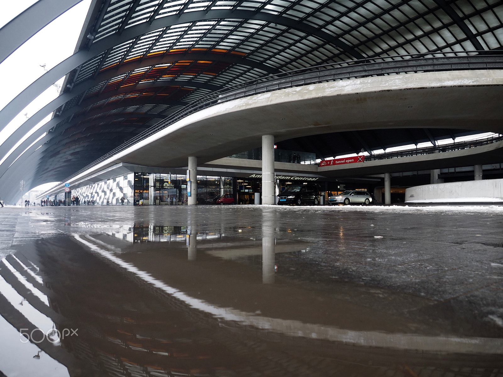 Olympus OM-D E-M1 sample photo. Wet day, amsterdam railway station photography