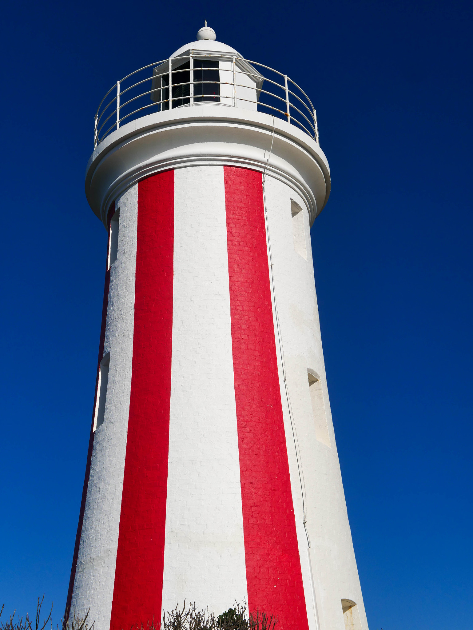 LUMIX G 25/F1.7 sample photo. Red lighthouse on the hill photography