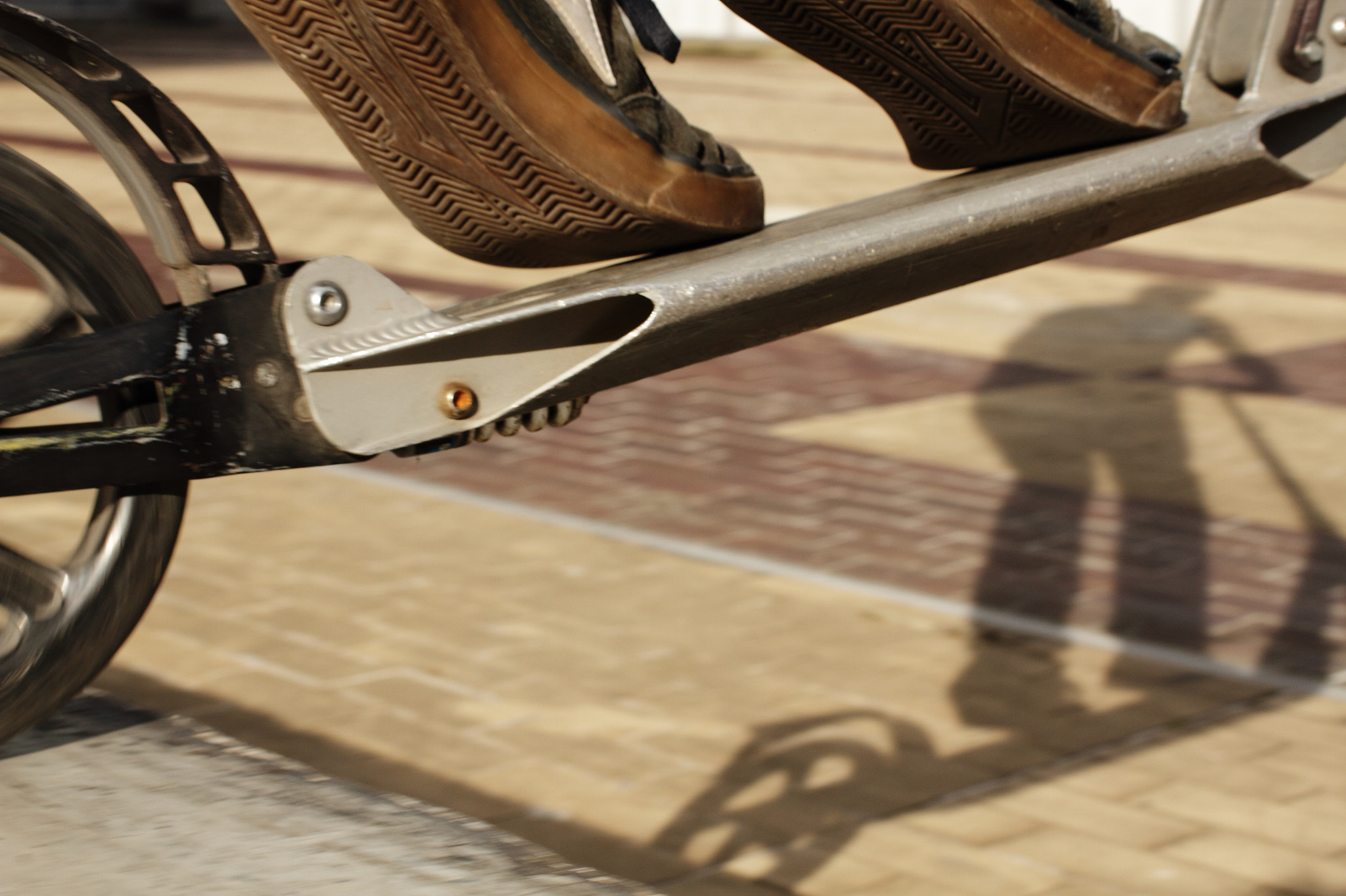 Canon EF 40mm F2.8 STM sample photo. The wheel the shoes and the shadow photography