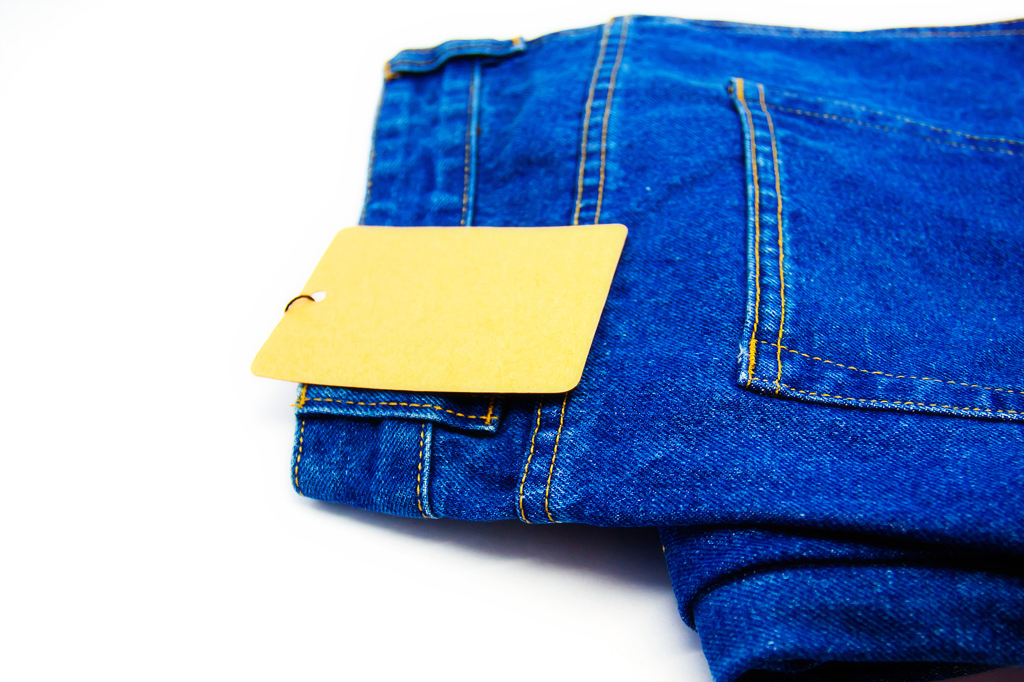 Canon EOS 50D + Canon EF 17-40mm F4L USM sample photo. Blue jeans back pocket isolated on the white background photography