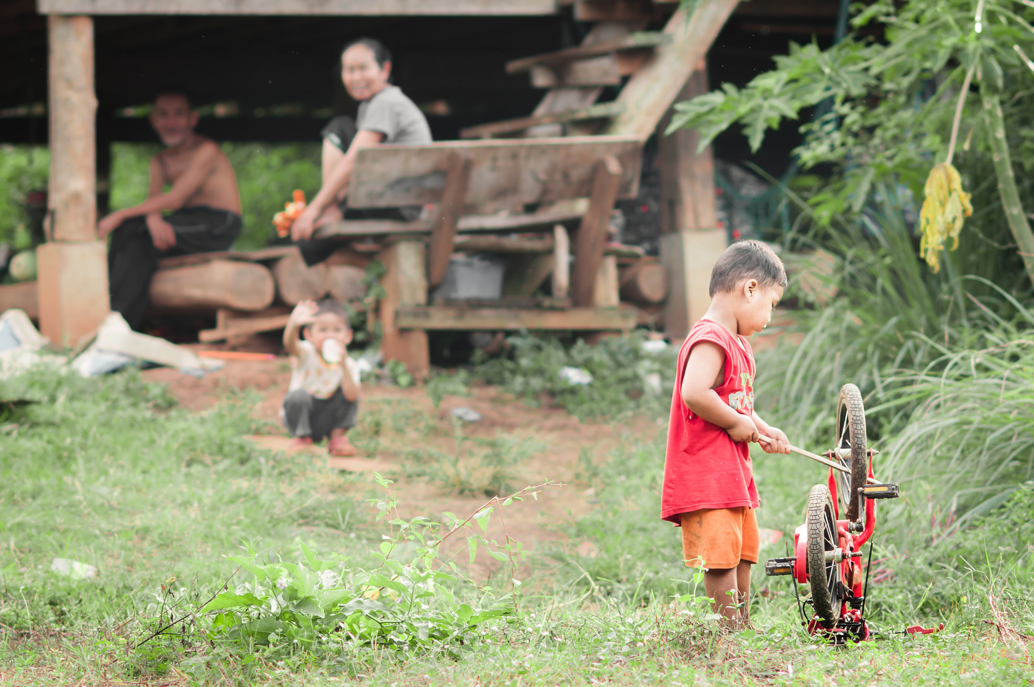 Nikon D300 + AF DC-Nikkor 135mm f/2D sample photo. Little boy playing with bicycle. photography