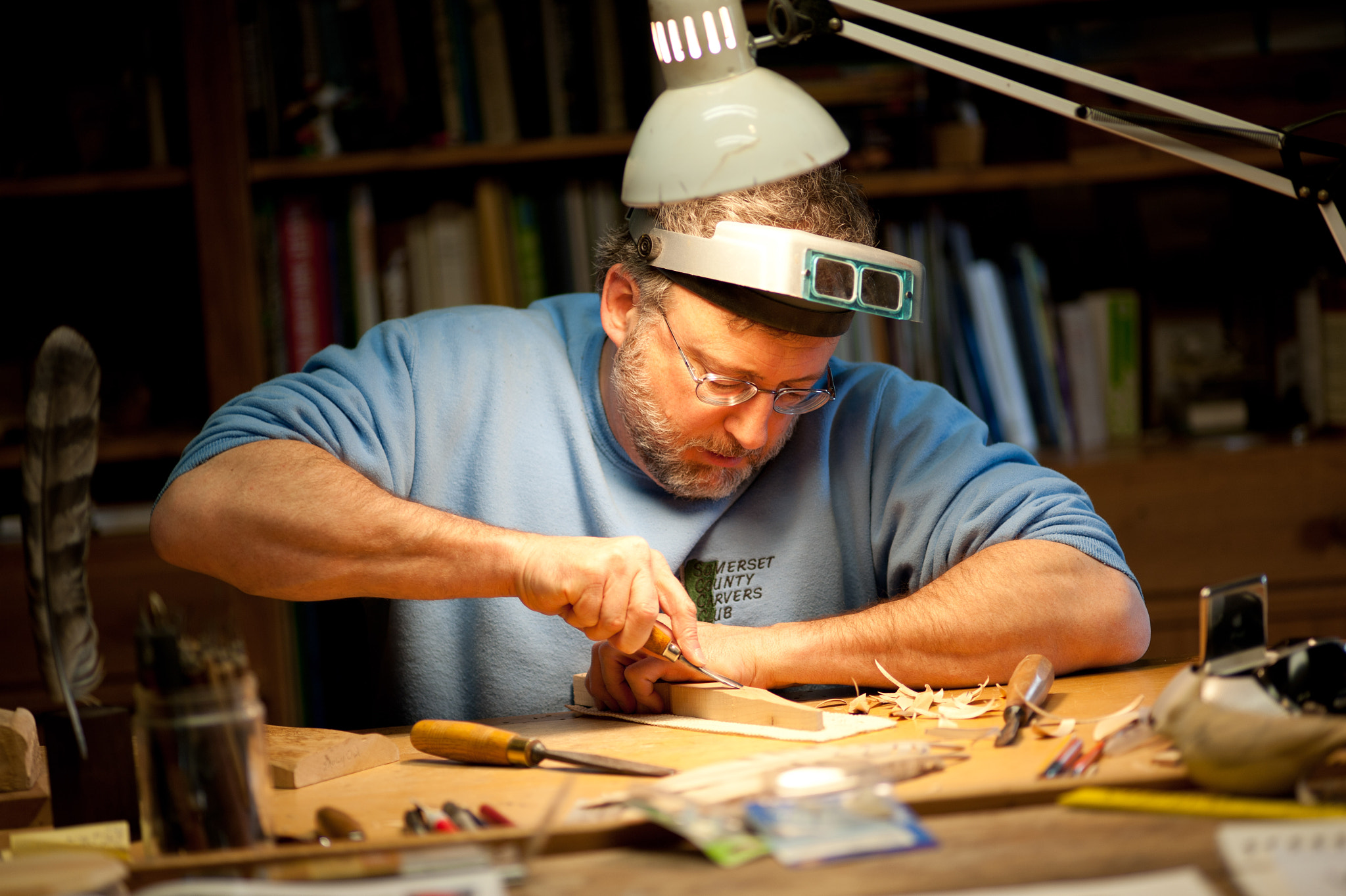 Nikon D700 sample photo. Man carving wood in workshop photography