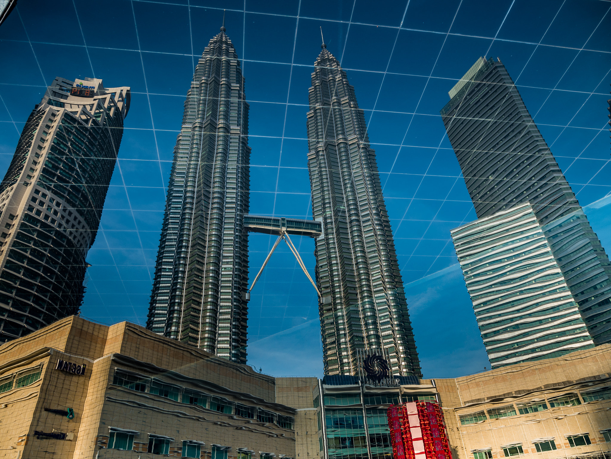 Panasonic Lumix G X Vario 12-35mm F2.8 ASPH Power OIS sample photo. Petronas twin tower kl malaysia reflections photography