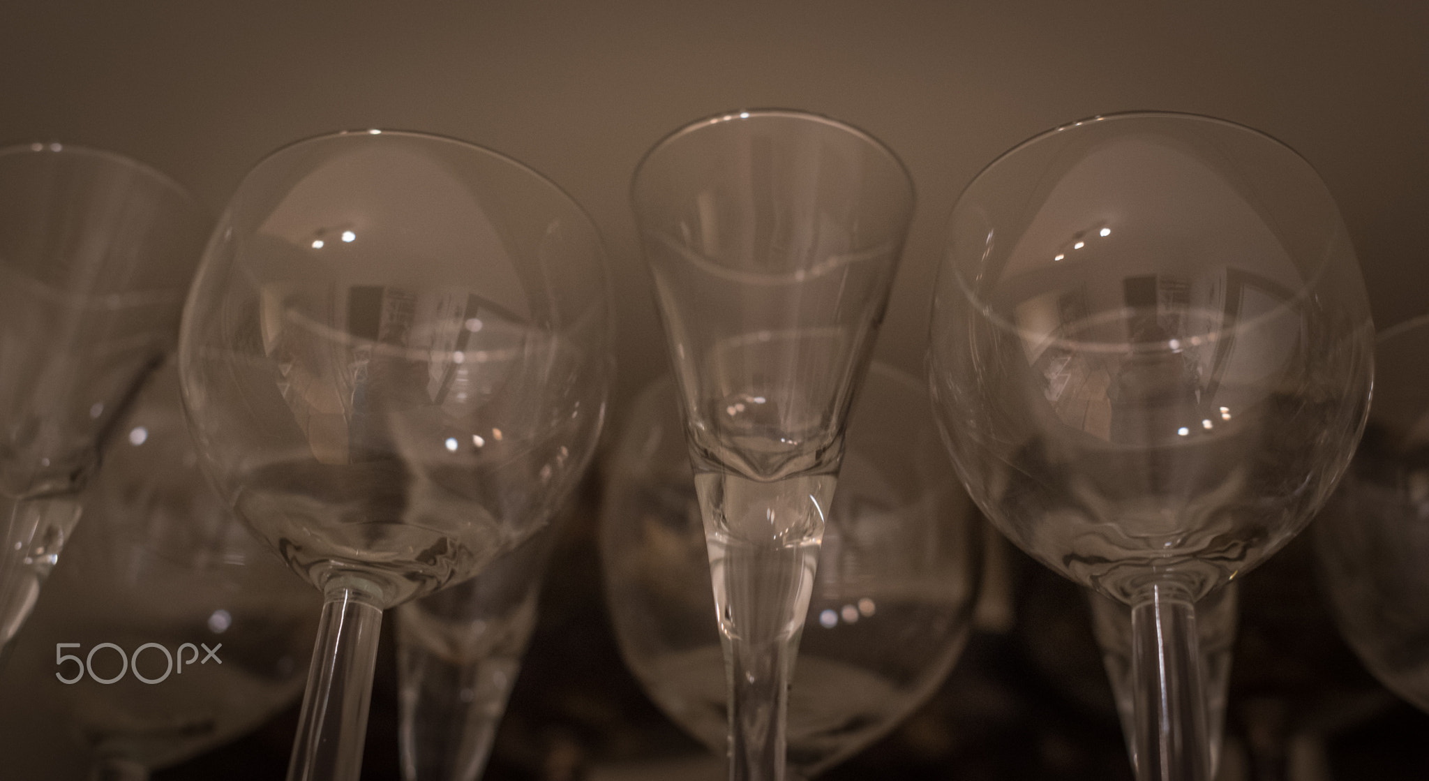 In our cabinet - A shelf of wine glasses