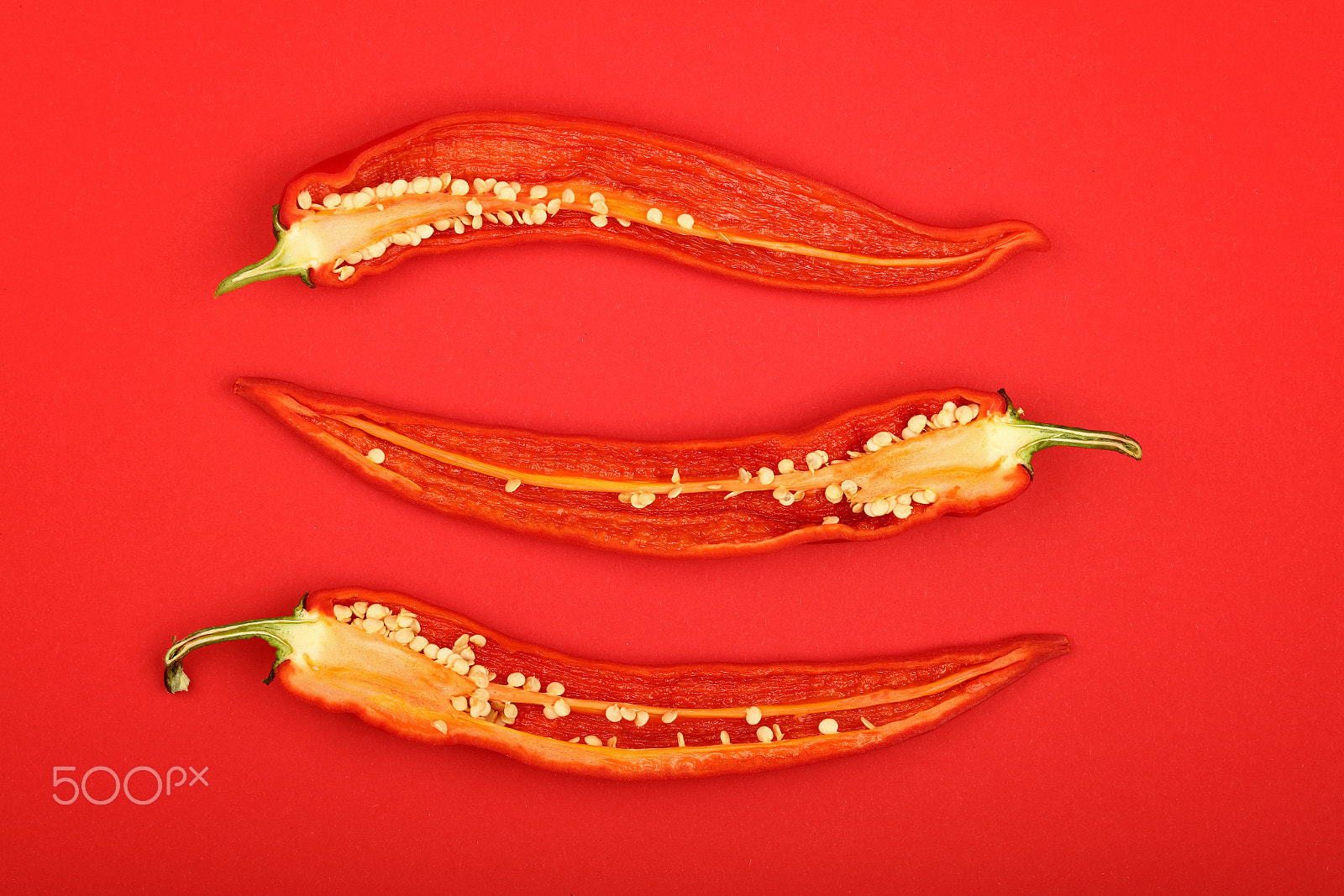 Canon EOS 5DS sample photo. Three halves of red hot chili peppers photography