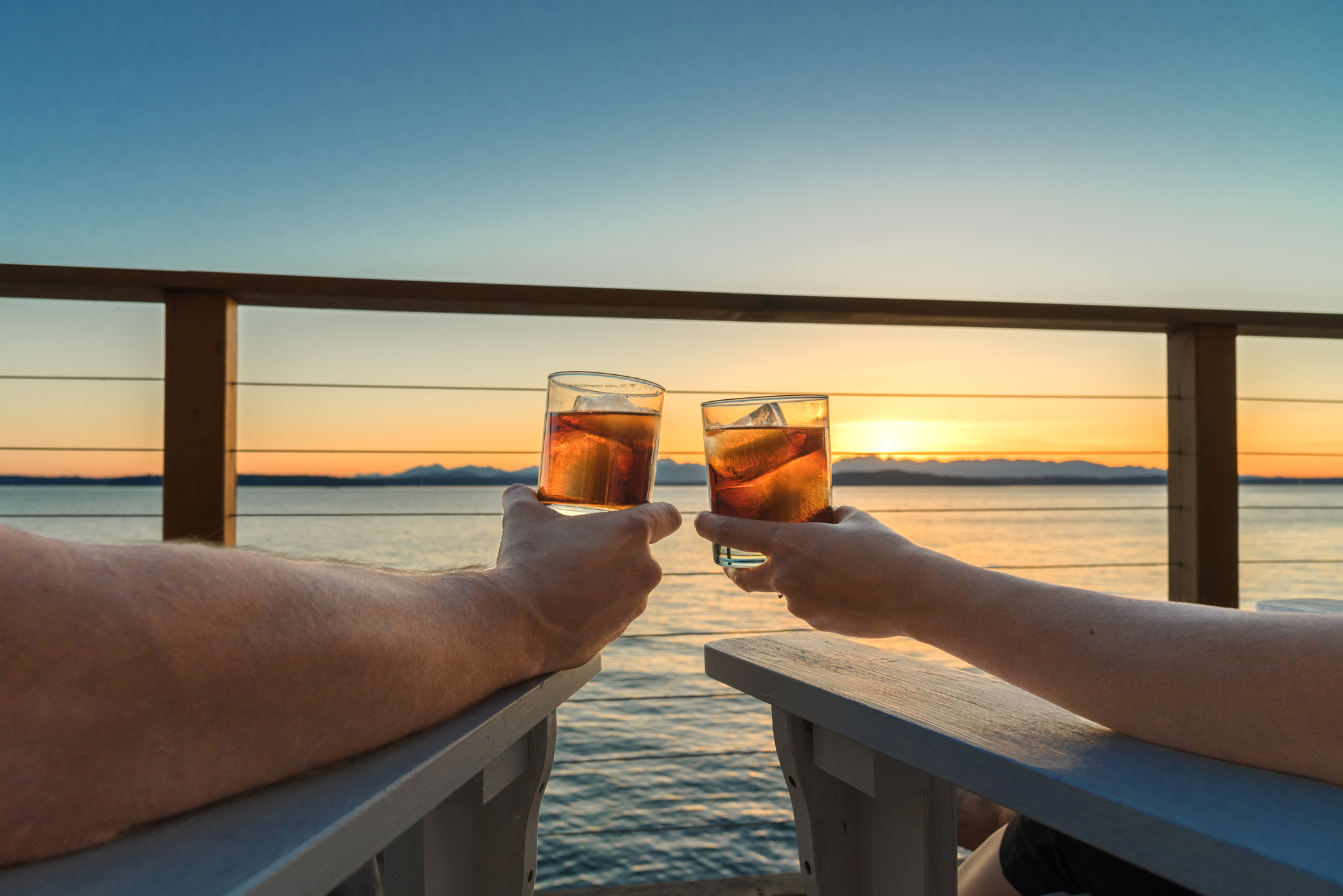 Sunset Toast by the Sea on the Rocks