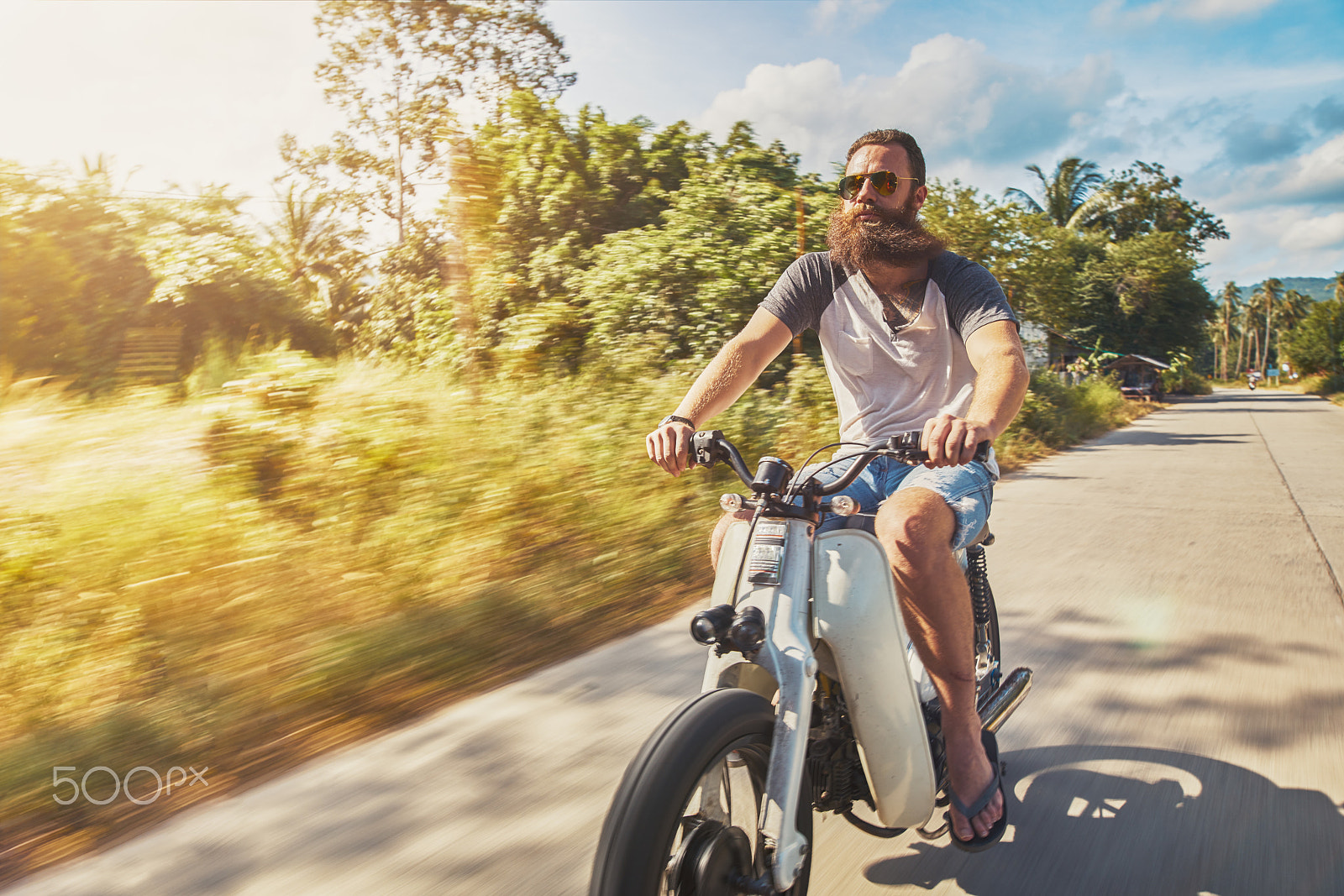 Metabones 24/1.4 sample photo. Driving vintage motorbike fast through country side in thailand photography