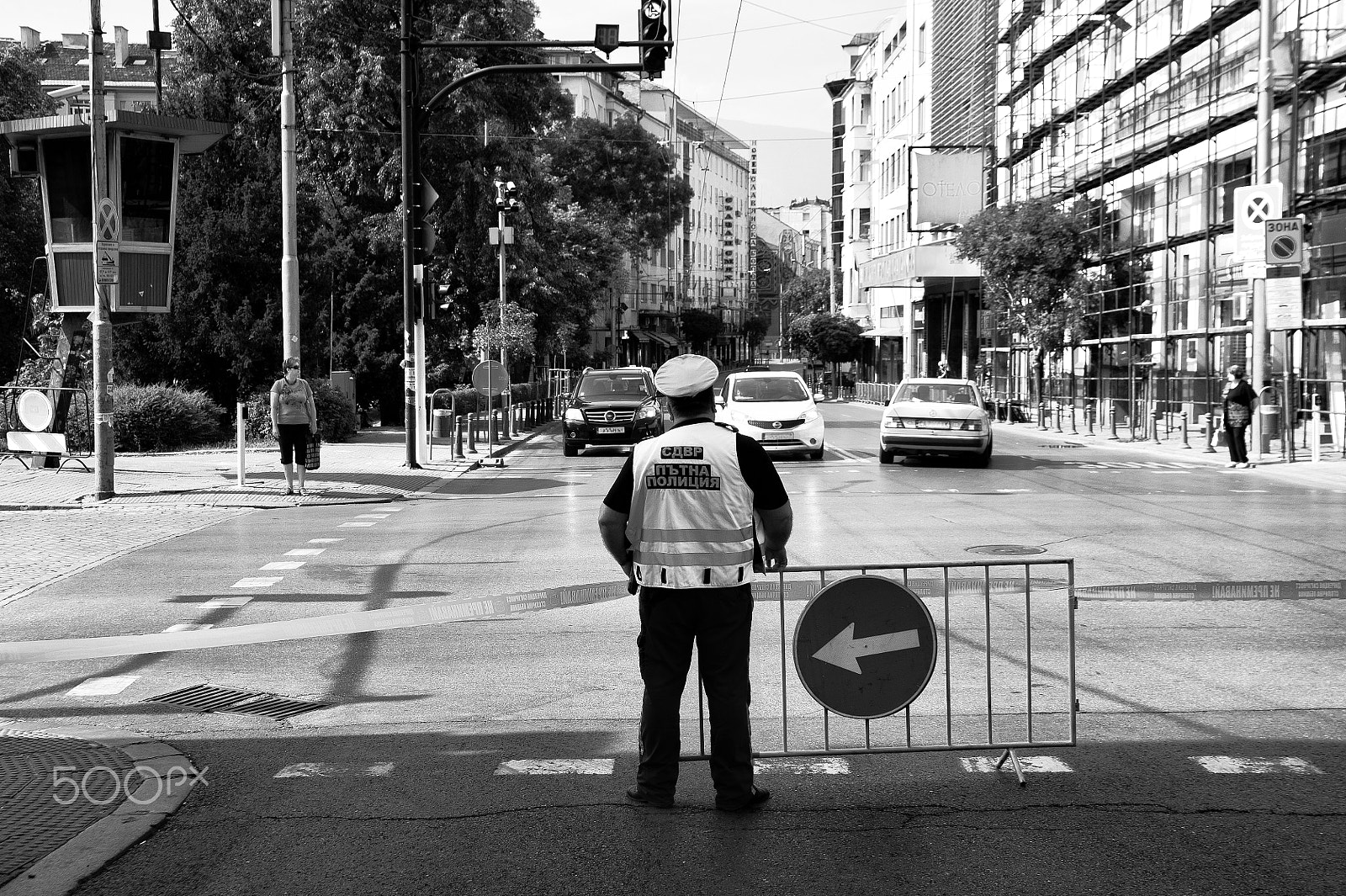 Tamron SP 24-70mm F2.8 Di VC USD sample photo. An urban police cuts the street to traffic. photography