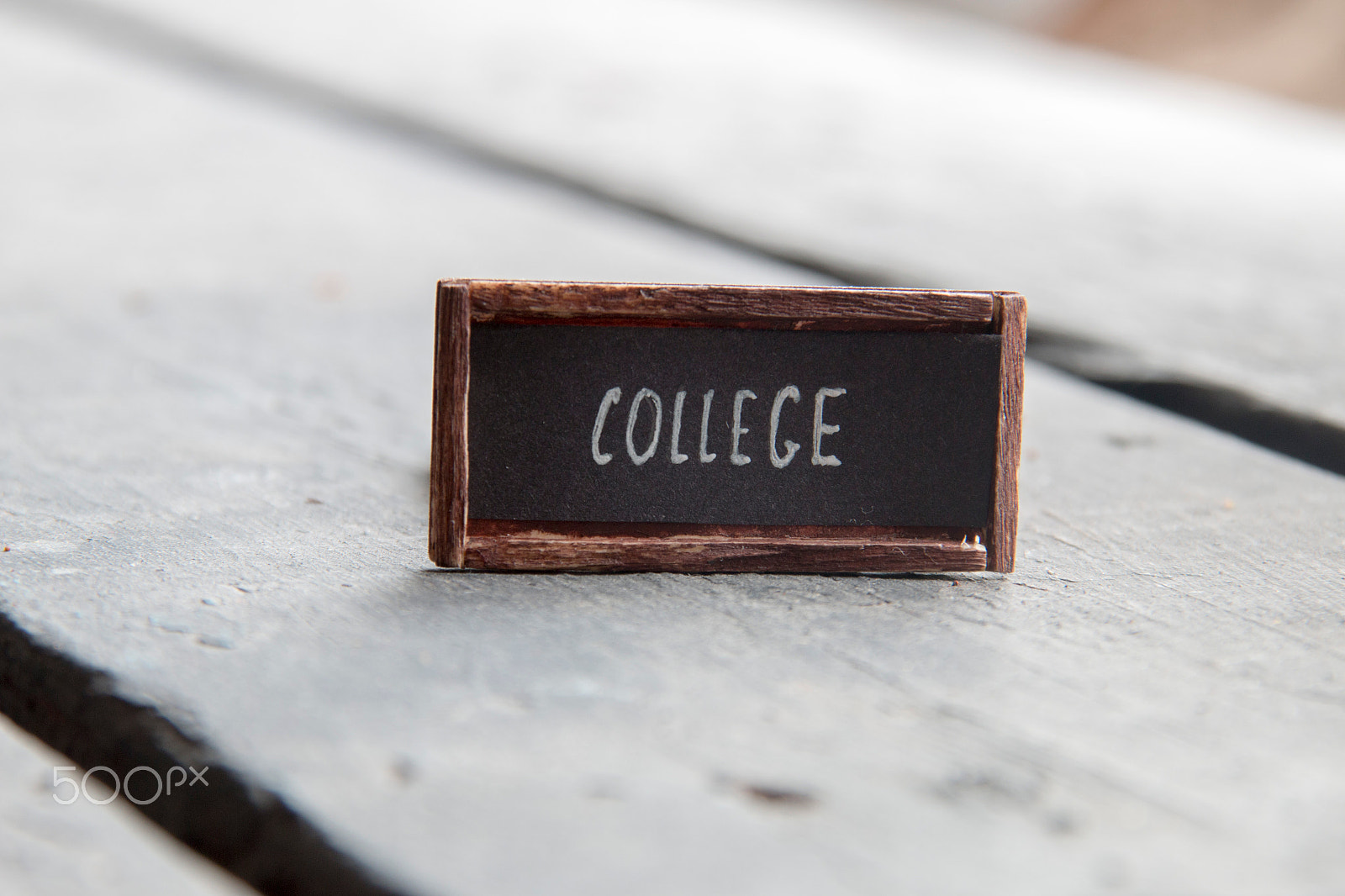 Sigma 18-200mm f/3.5-6.3 DC OS sample photo. College concept, tag on an old table photography