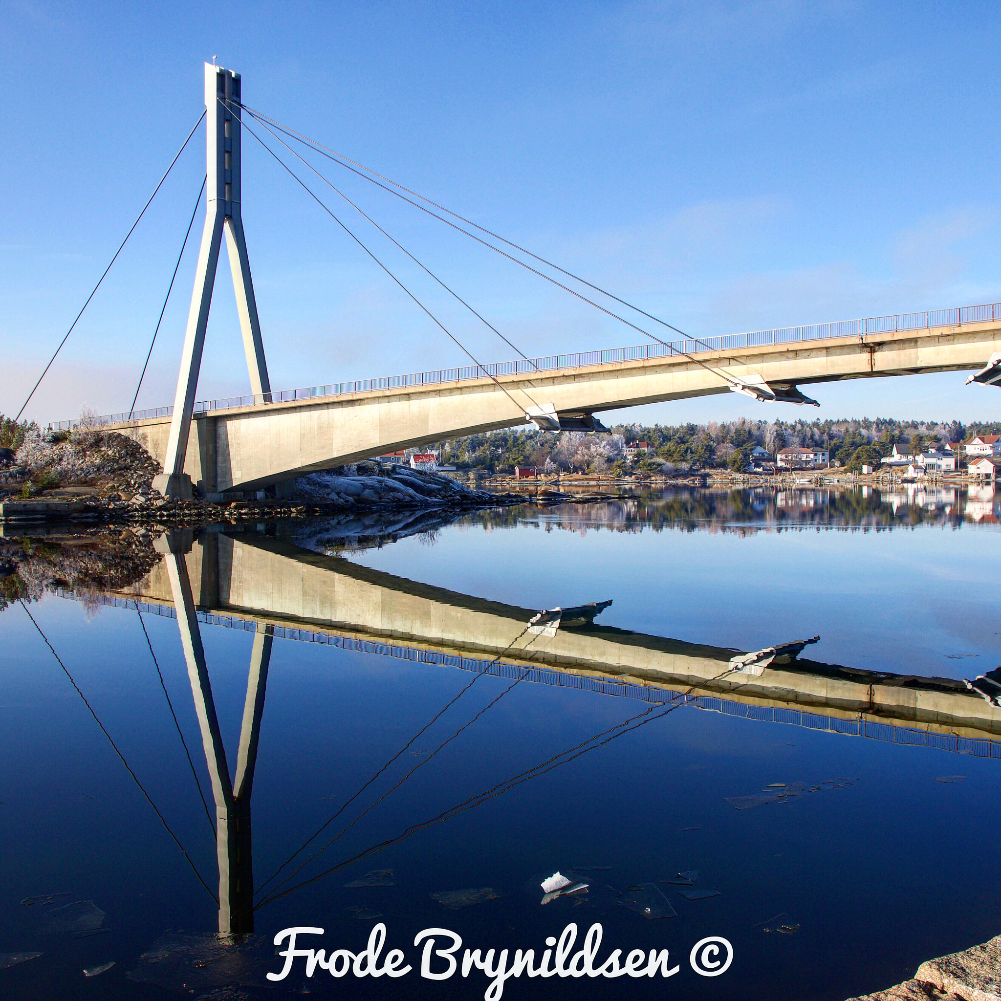 Sigma 17-70mm F2.8-4 DC Macro OS HSM sample photo. Beutiful wintherday today. bridge reflektion in the sea. photography