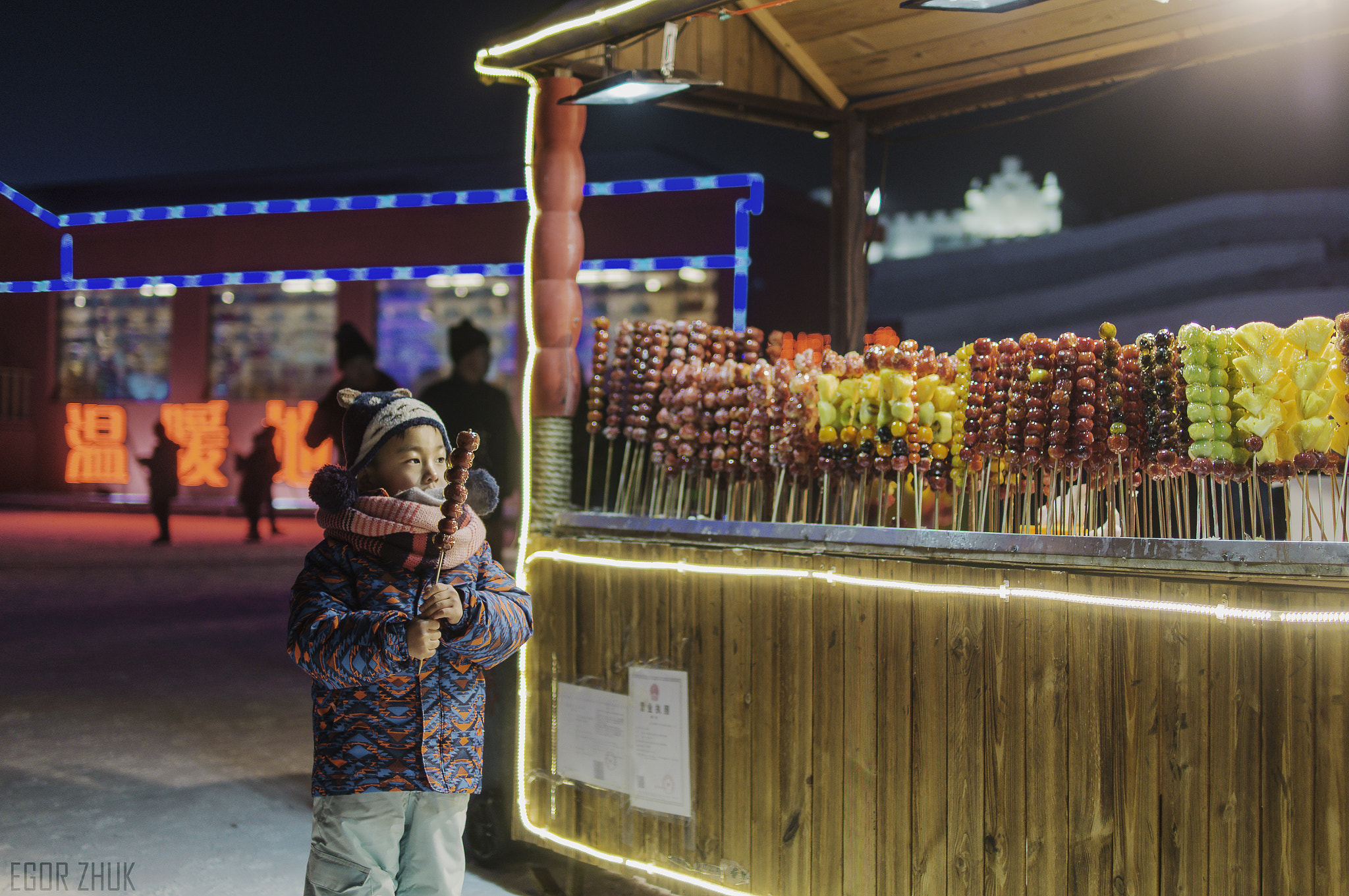 Sony SLT-A57 + DT 30mm F1.4 sample photo. Boy and tánghúlu(糖葫芦) photography