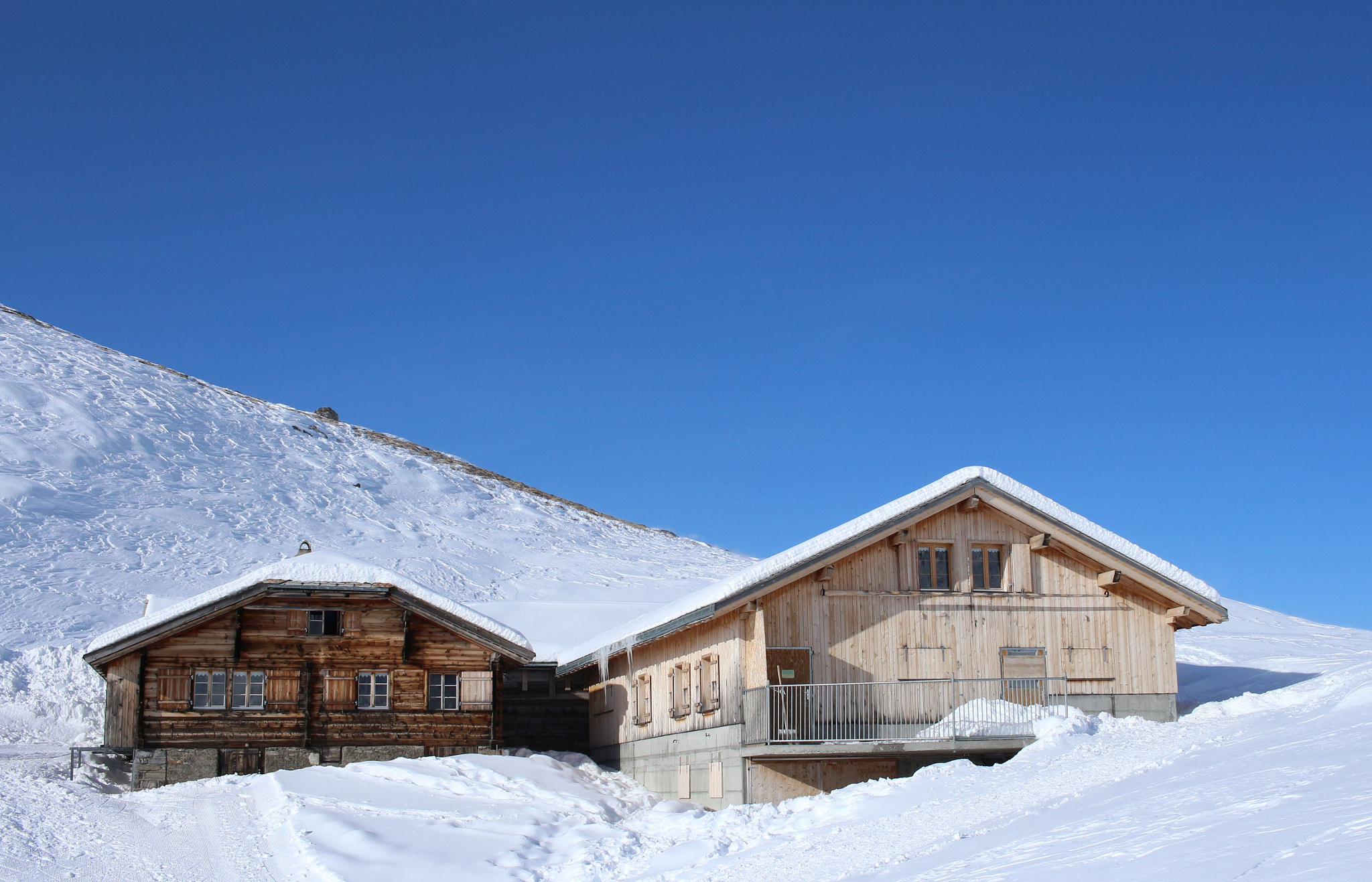 Canon EF-S 24mm F2.8 STM sample photo. Traditional swiss wooden mountain houses photography