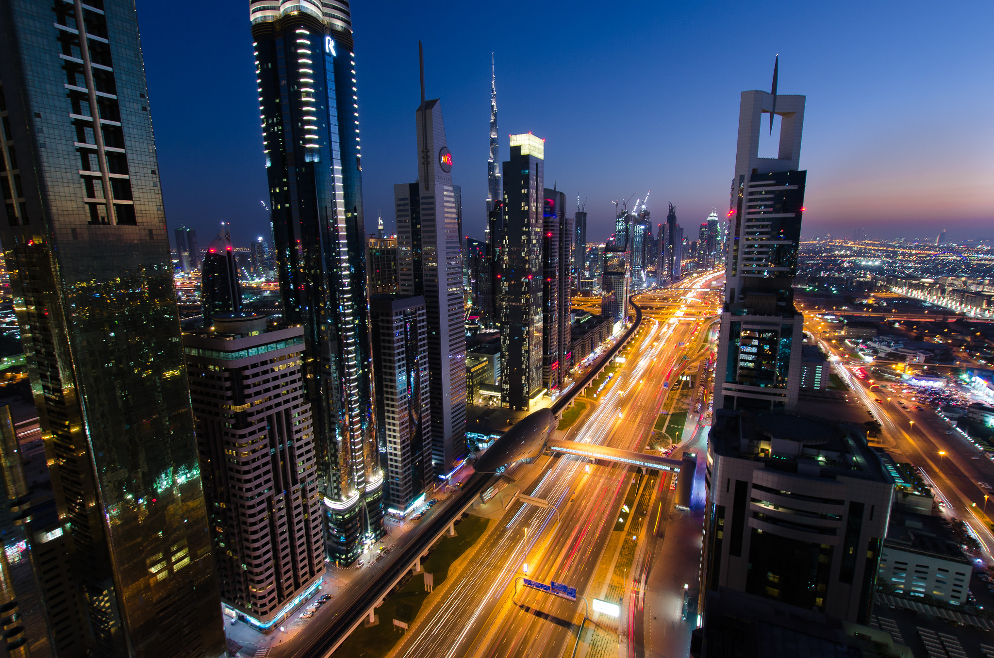 Nikon D7000 + Sigma 10-20mm F3.5 EX DC HSM sample photo. Dubai light trails into the sunset photography