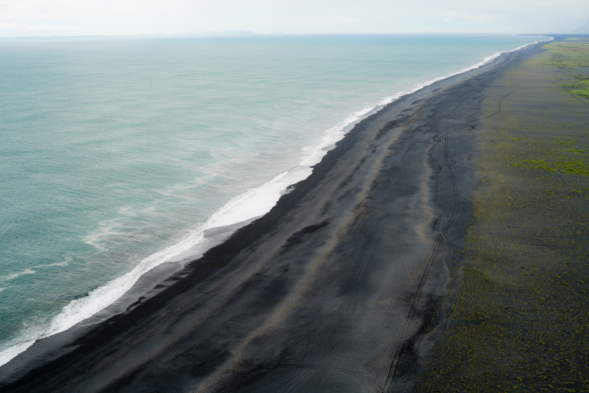 E 50mm F2 sample photo. Black beach photography
