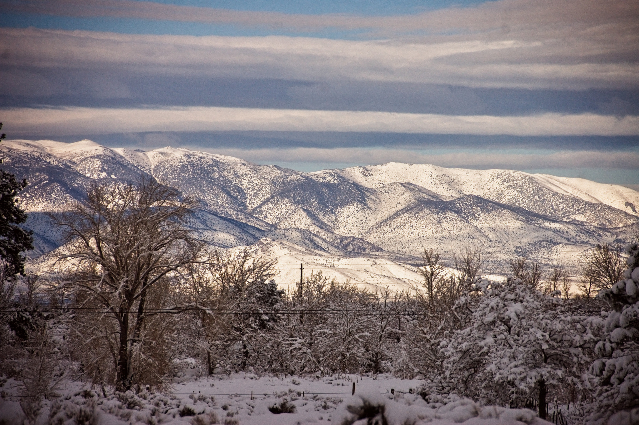 Nikon D40 sample photo. Sunlit snow covered mountains photography