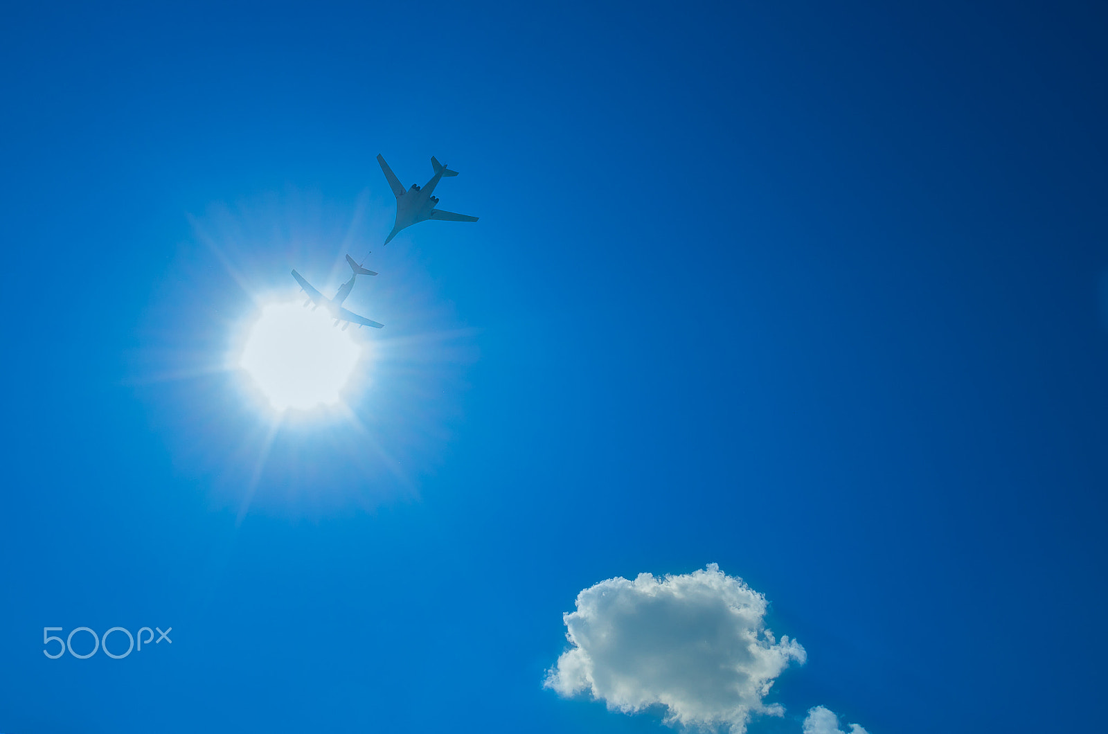 Pentax K-5 II + smc PENTAX-DA L 18-55mm F3.5-5.6 sample photo. Two bombers flying through the sun down photography