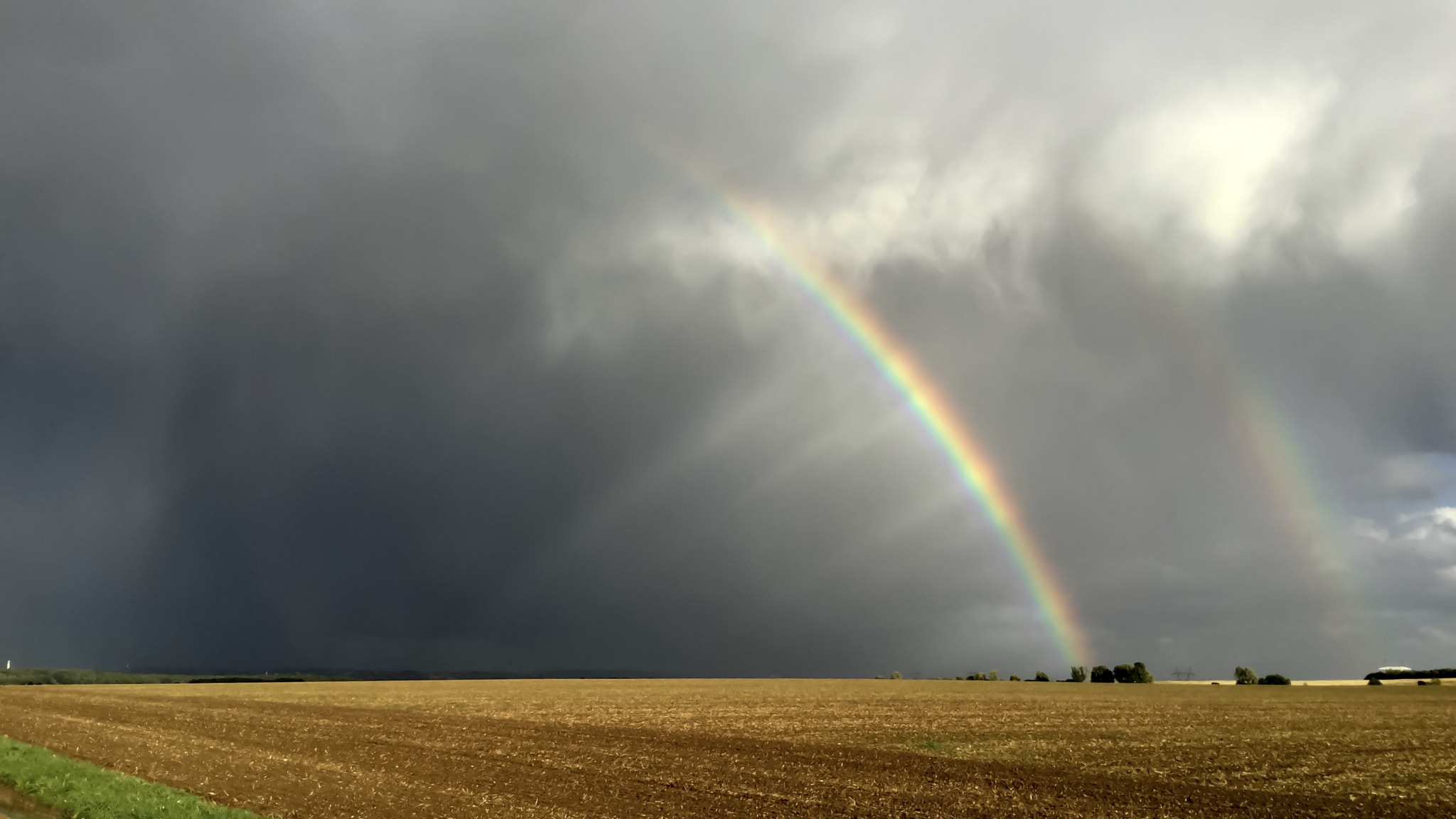 iPad Air 2 back camera 3.3mm f/2.4 sample photo. Rainbow after hail storm. close to cdg airport. photography