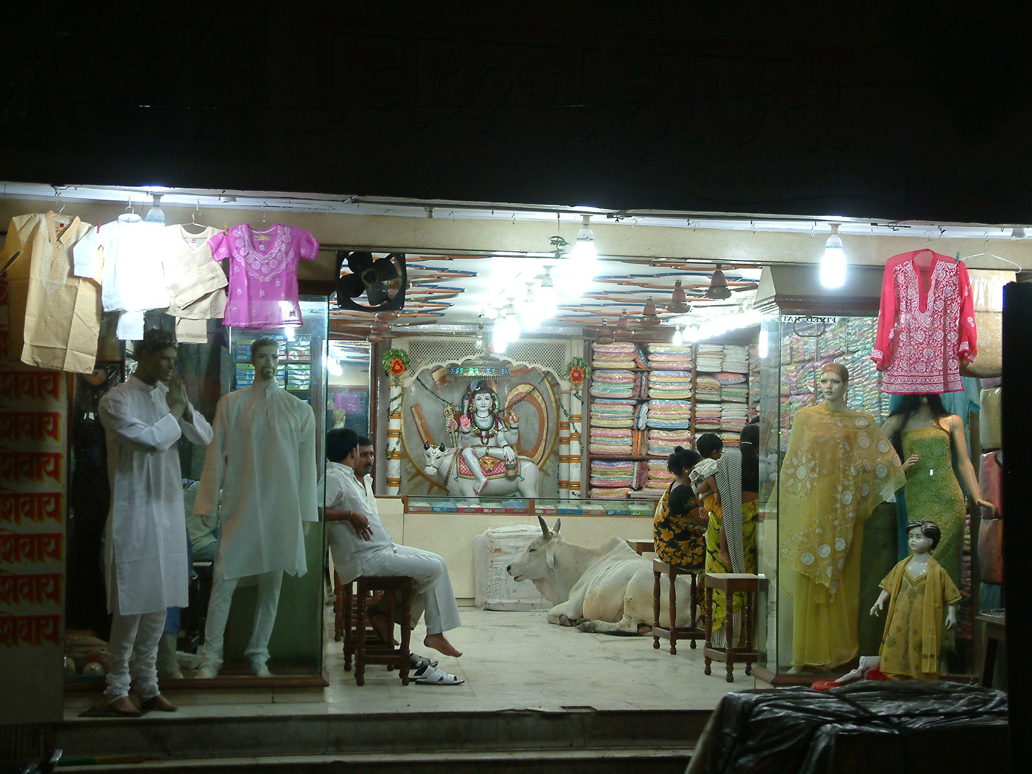 Fujifilm FinePix S602 ZOOM sample photo. India shop with cow - vanarasi india photography