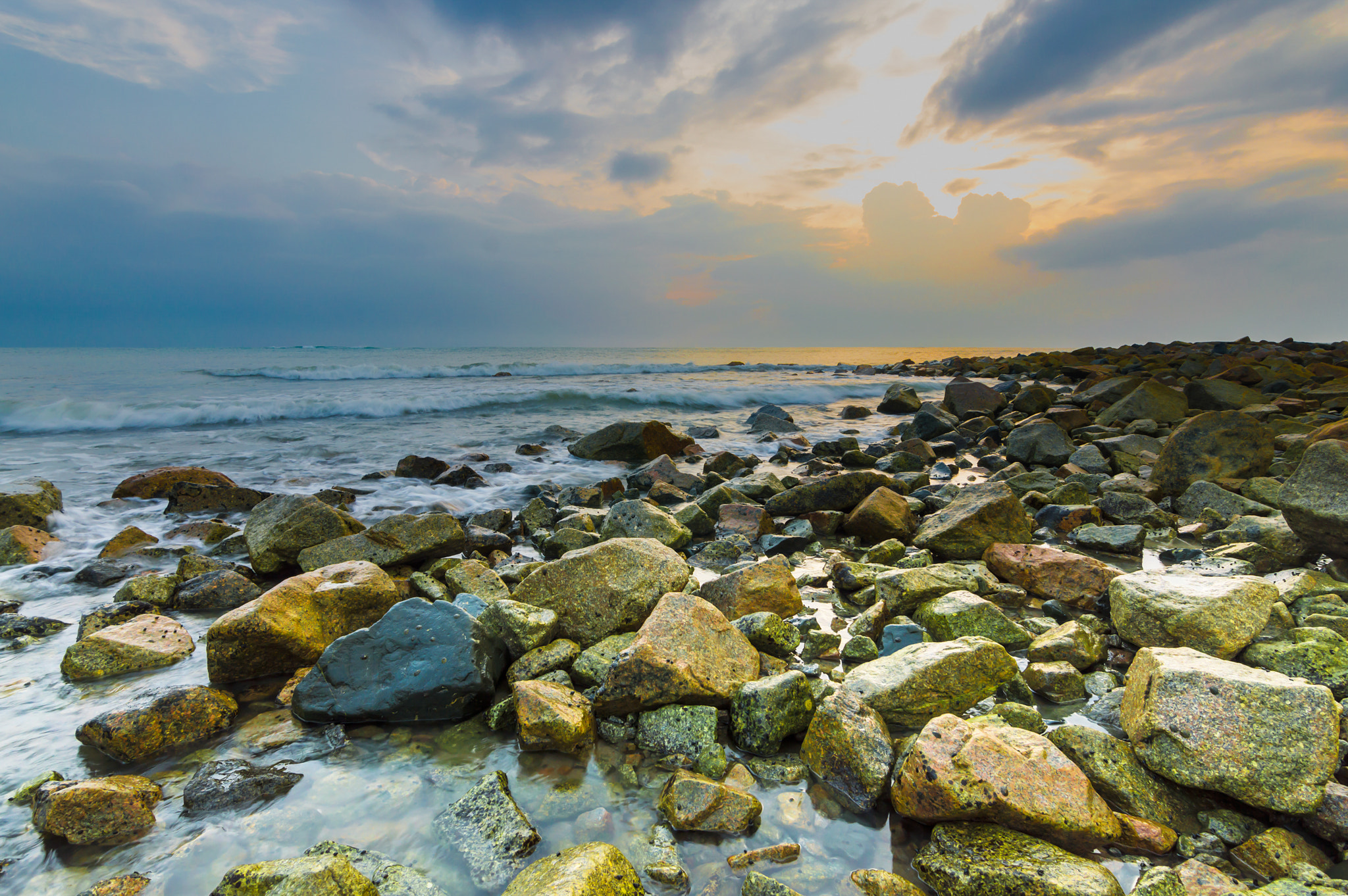 Nikon D3200 sample photo. Beach stone with sunrise background photography